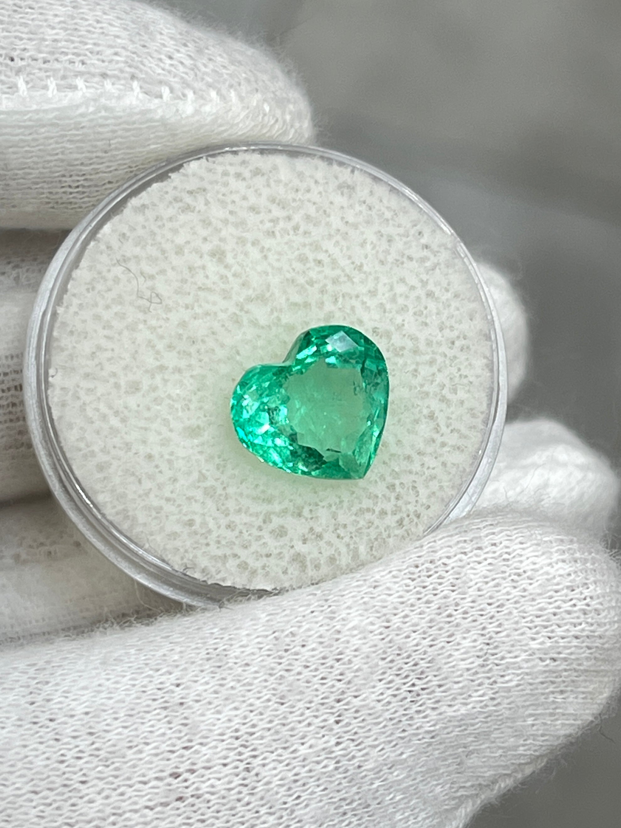 Bright medium green 3.24 carat Colombian emerald heart cut by JR Colombian Emeralds, showcasing vivid color and clarity.