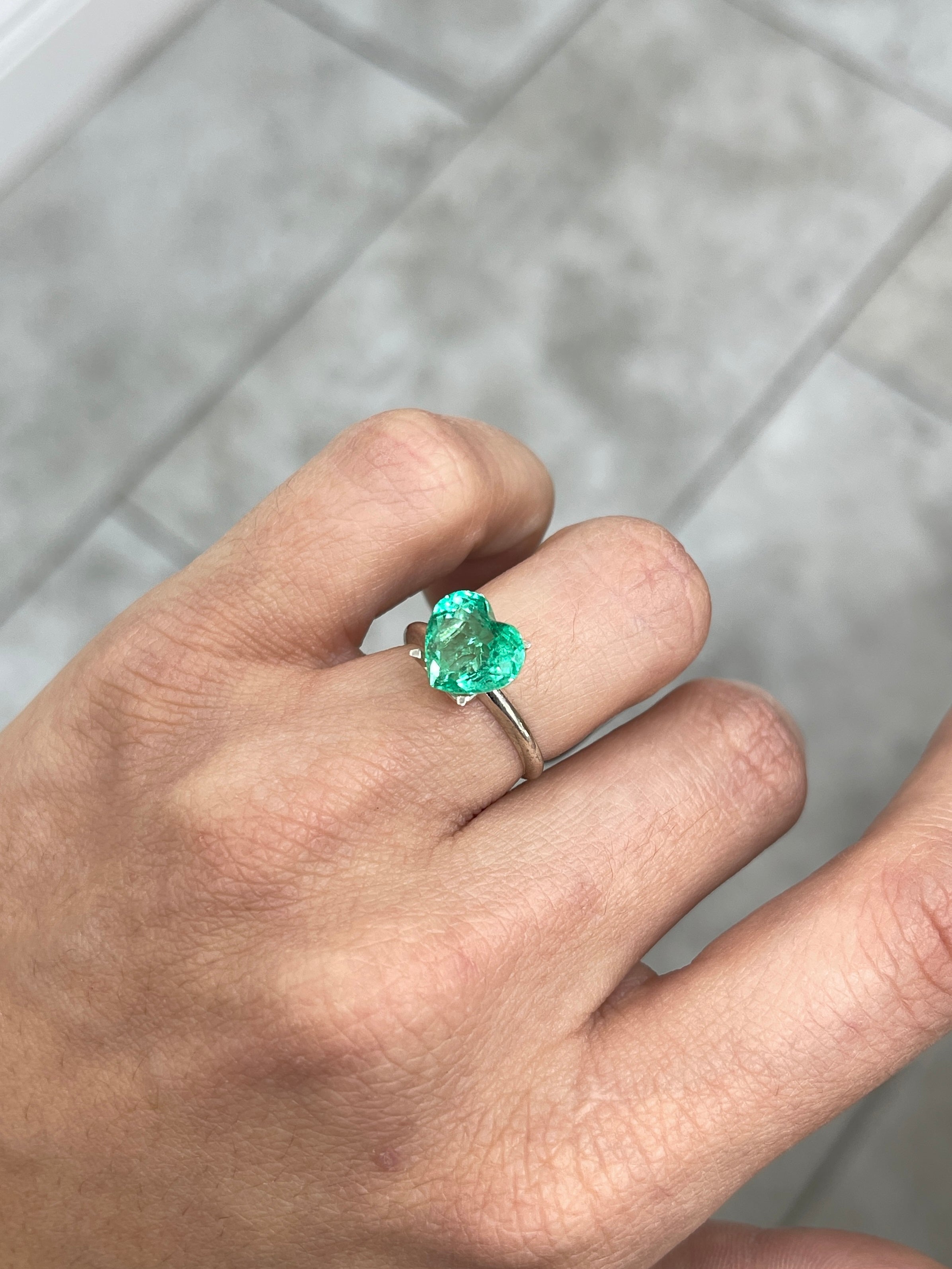 Bright 3.24 carat medium green Colombian emerald in heart shape, showcasing vibrant color and clarity, from JR Colombian Emeralds.