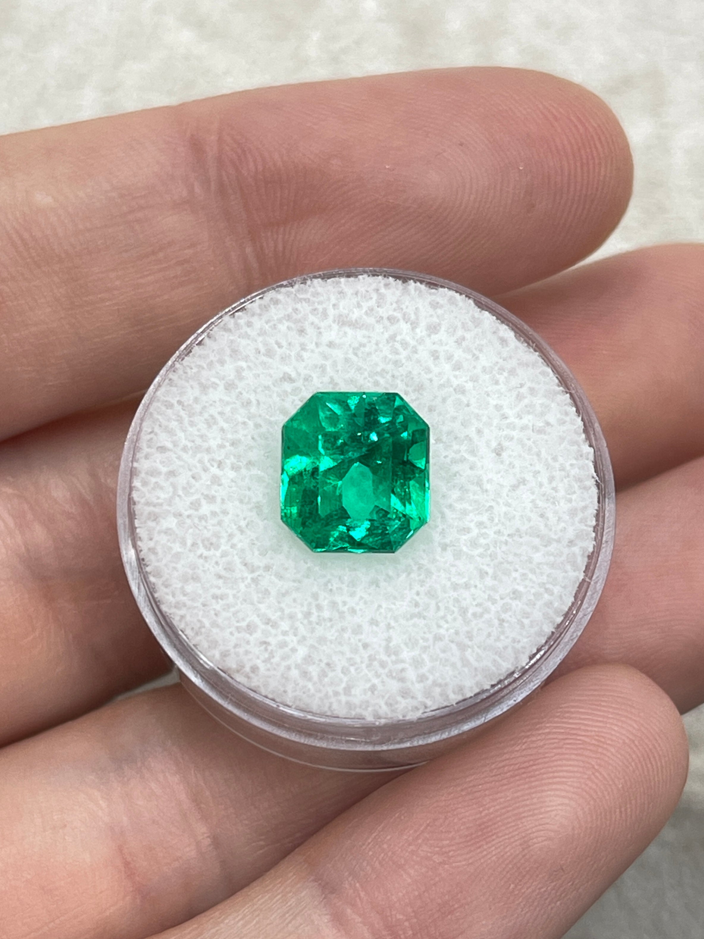 Vivid yellowish green 3.26 carat Colombian emerald cut gemstone from JR Colombian Emeralds, showcasing its vibrant color and clarity.