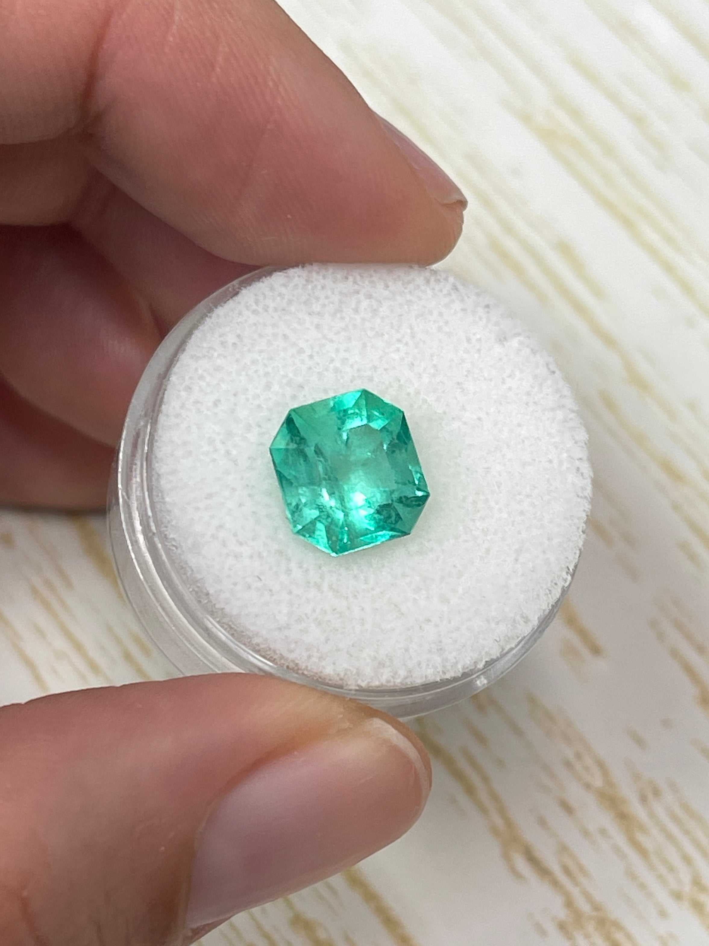 Natural 3.27 carat Colombian Emerald Asscher cut loose gemstone from JR Colombian Emeralds, showcasing vibrant green color and clarity.