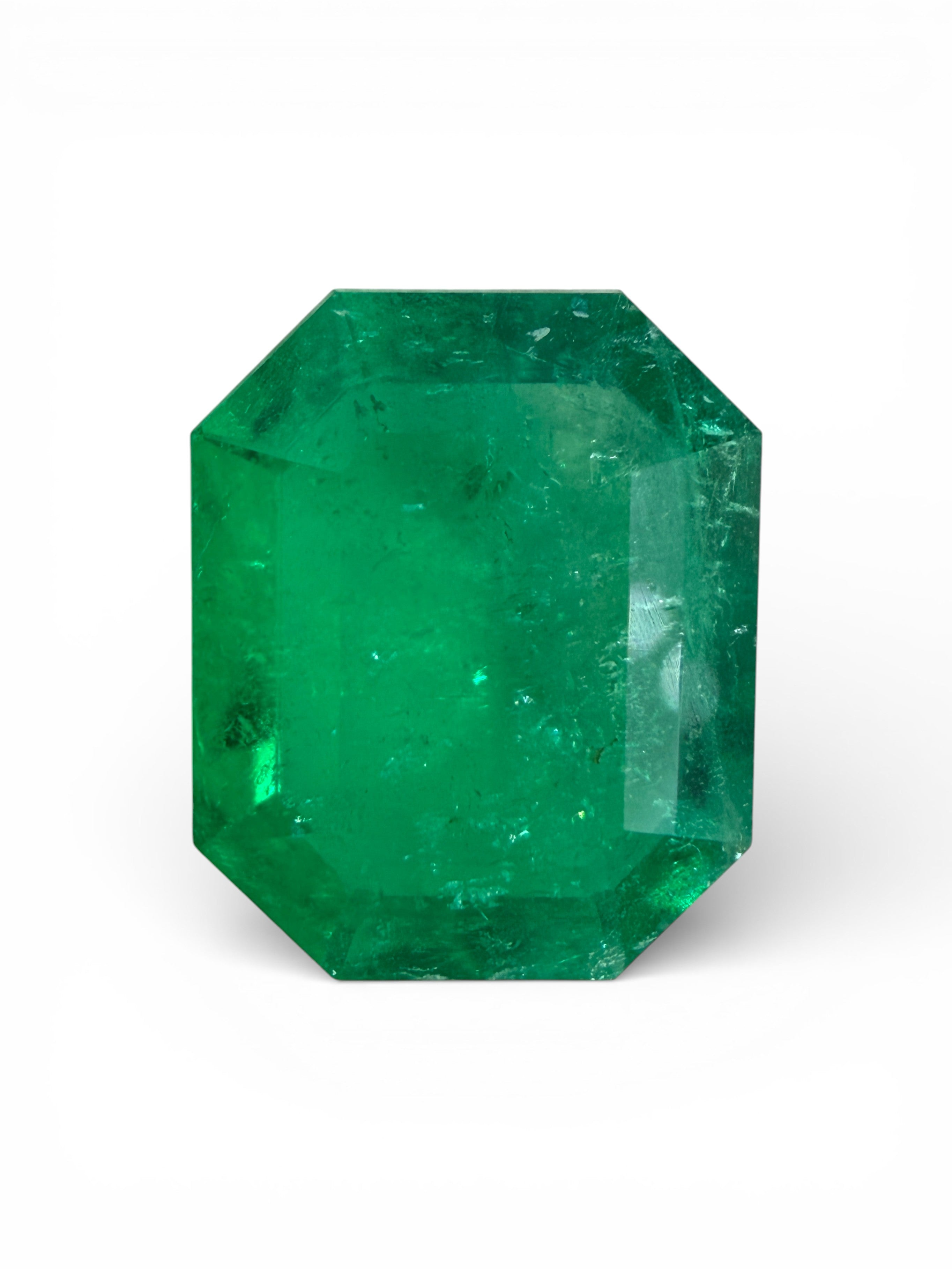 3.30 carat Muzo Colombian emerald cut loose emerald gemstone in classic green, natural, with rectangular shape and faceted design.