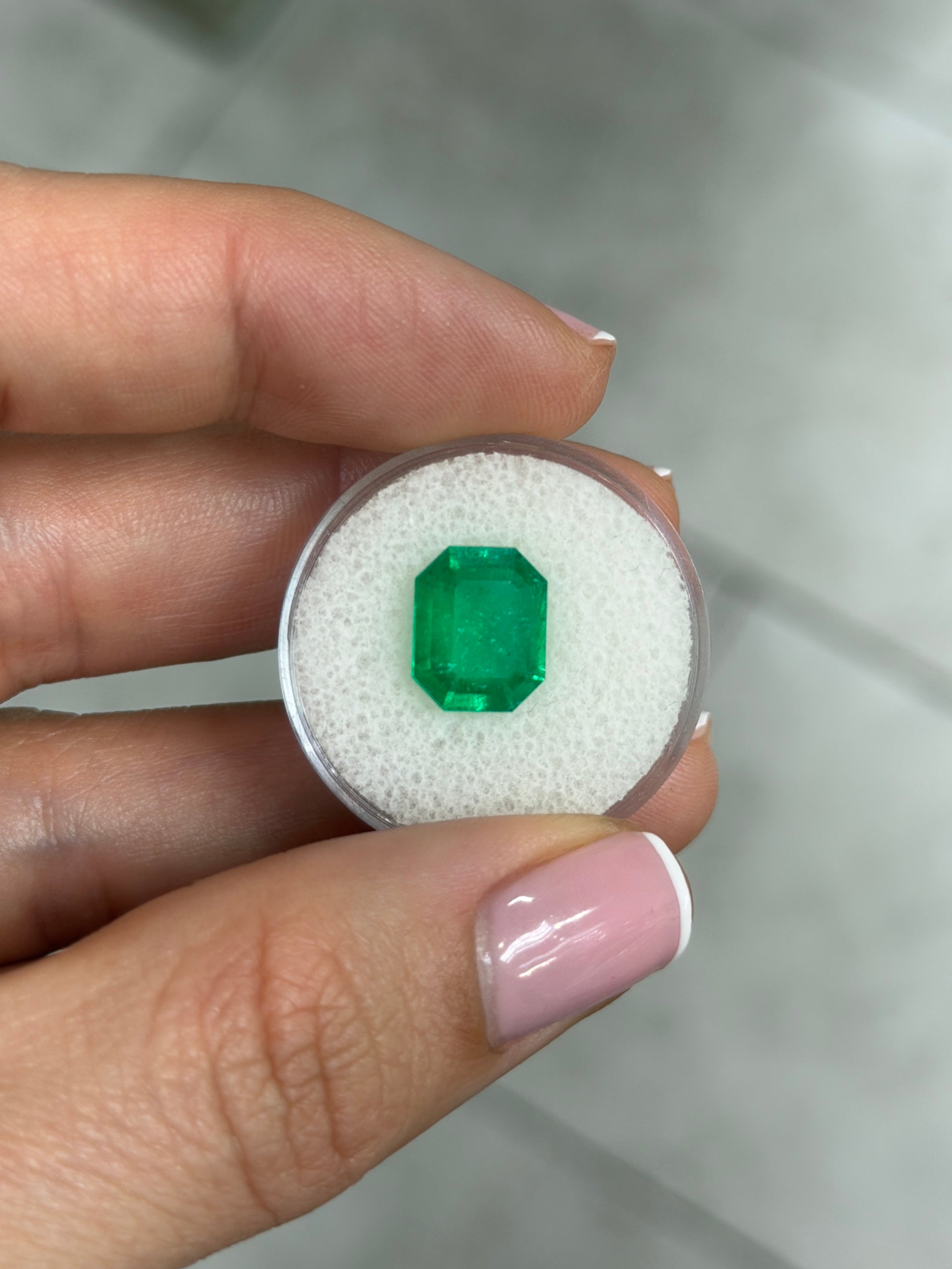 3.30 carat natural Colombian Muzo emerald cut loose emerald, vibrant green gemstone with clarity and classic shape.