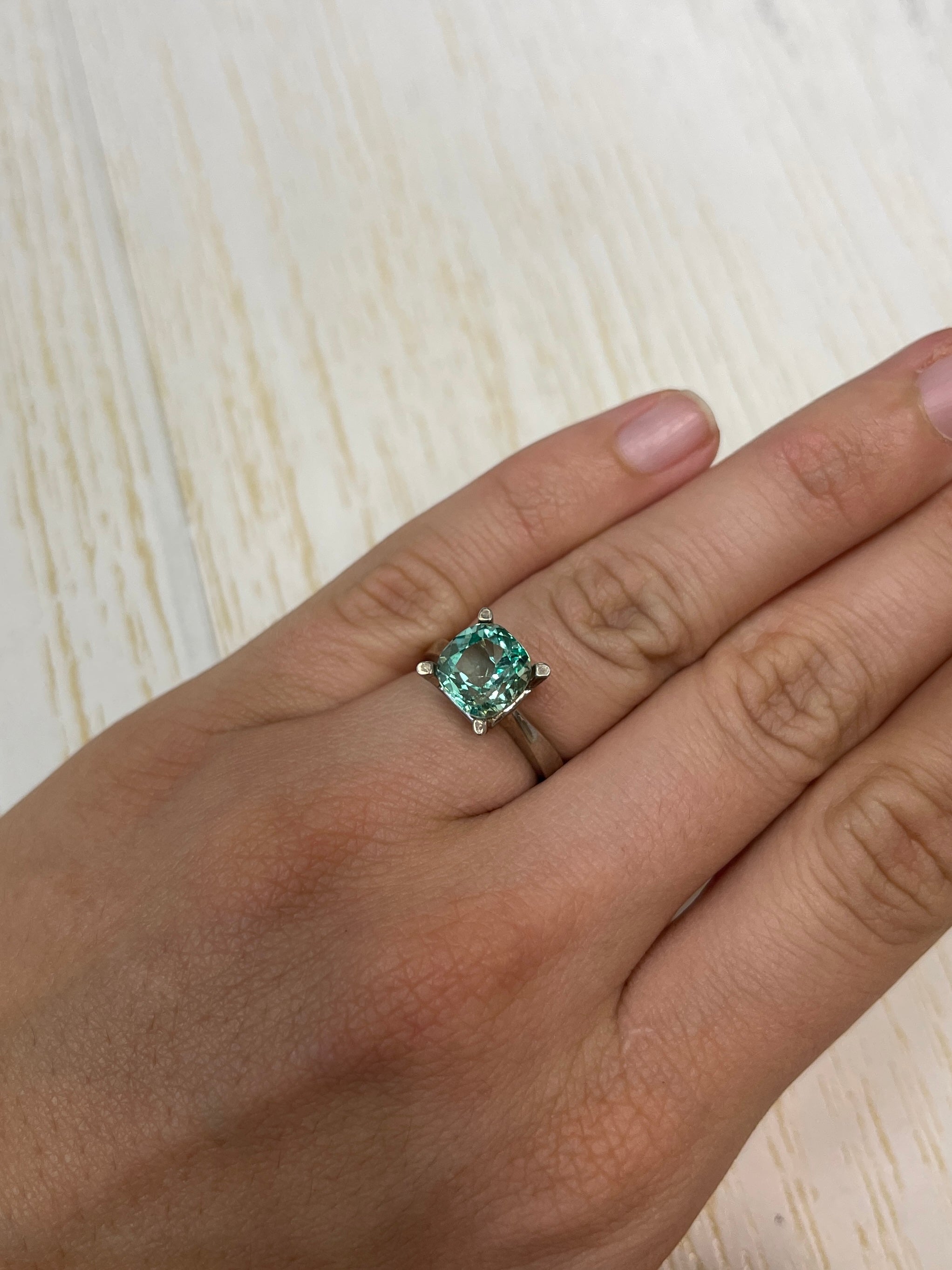 Natural loose Colombian emerald, 3.31 carats, cushion cut, pastel light green, from JR Colombian Emeralds.