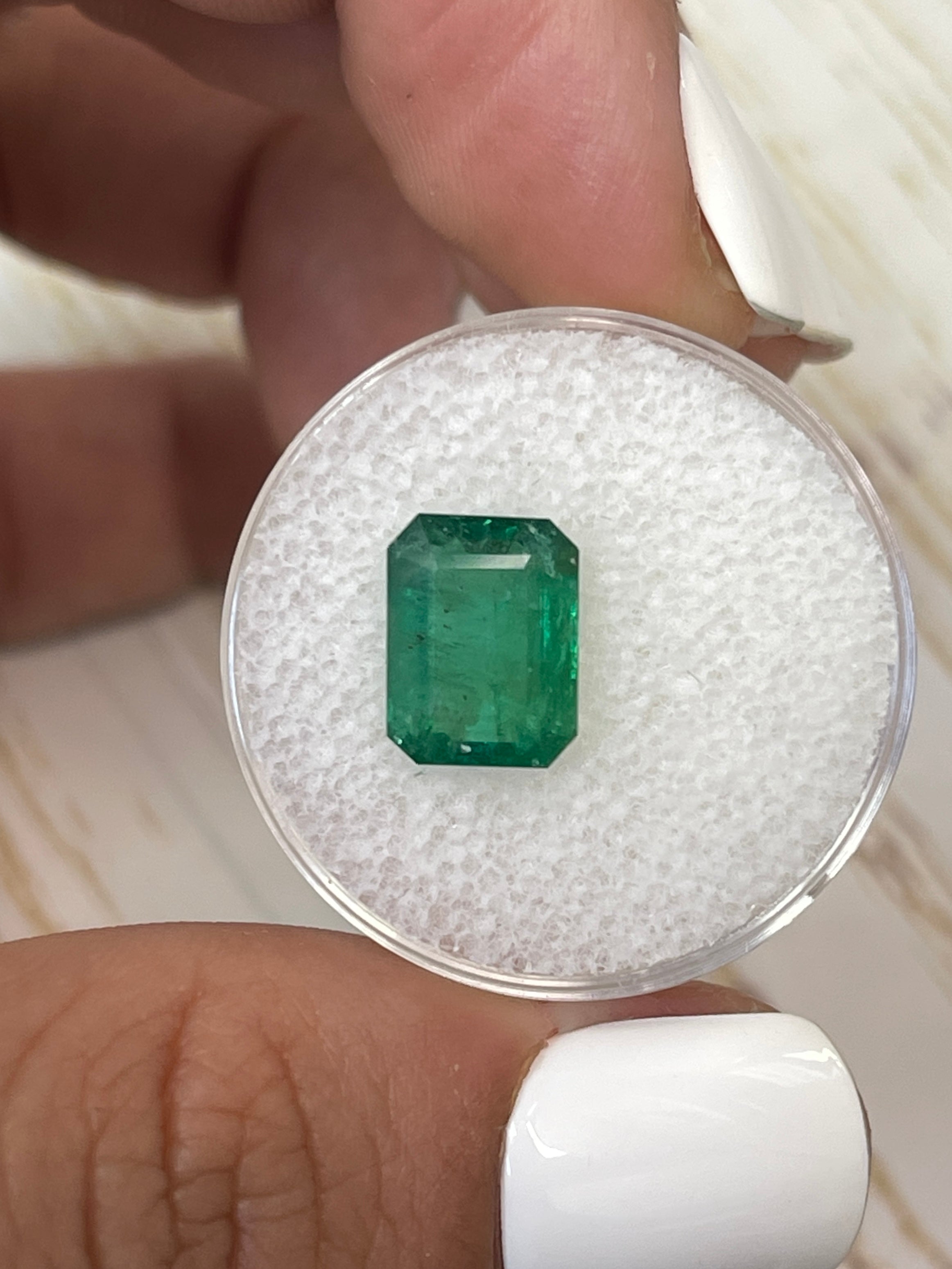 3.31 carat mossy green natural Zambian emerald in emerald cut, loose gemstone from JR Colombian Emeralds.