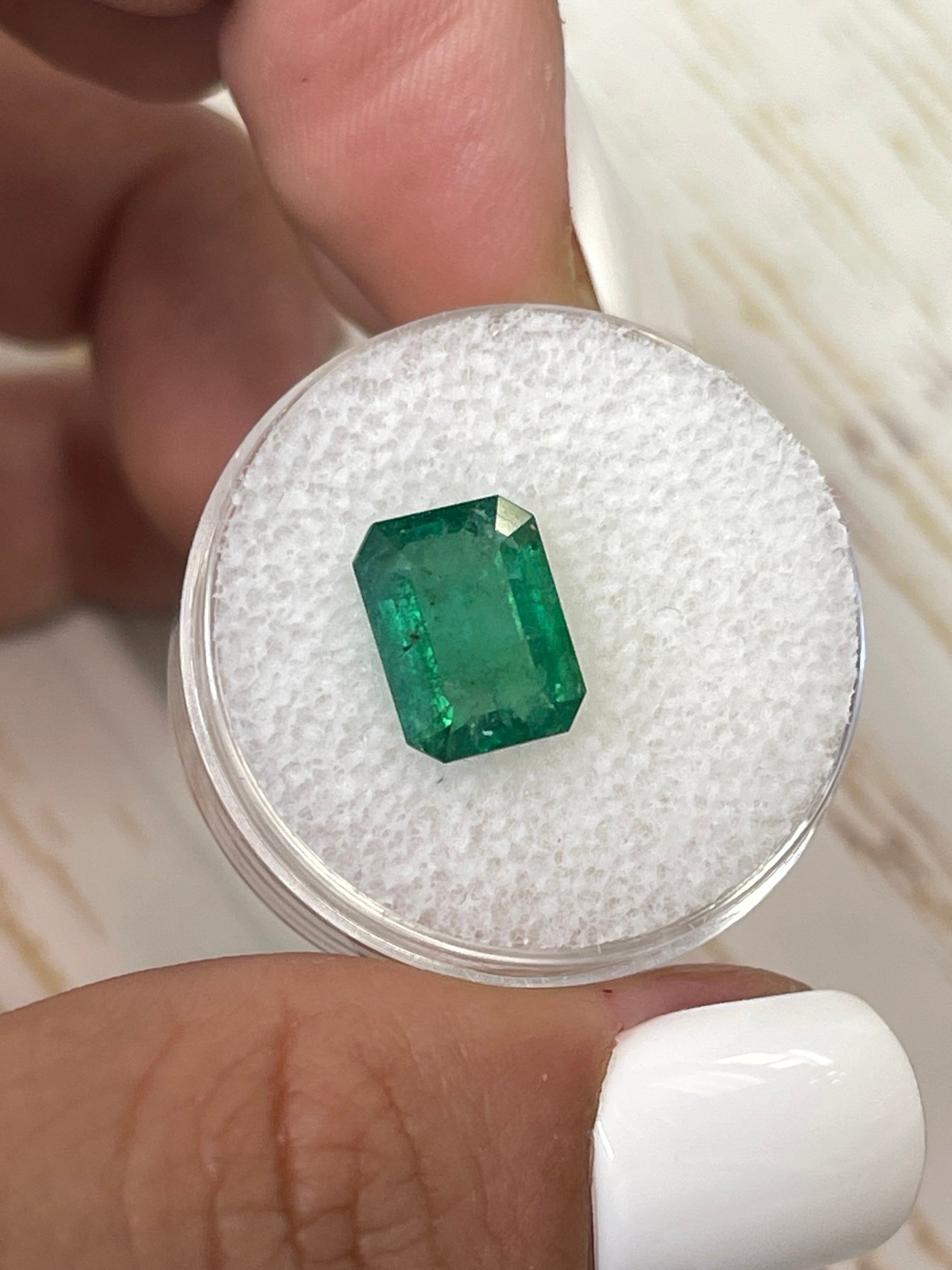 3.31-carat mossy green natural Zambian emerald loose gemstone in emerald cut, showcased by JR Colombian Emeralds.