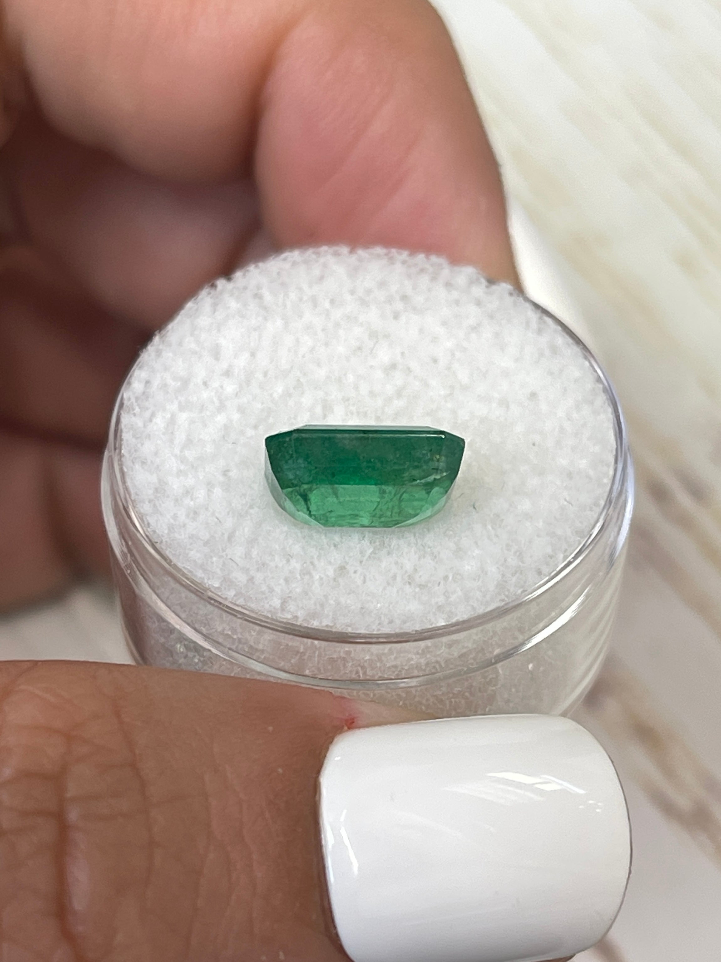 3.31 carat mossy green natural Zambian emerald in emerald cut, loose gemstone from JR Colombian Emeralds.