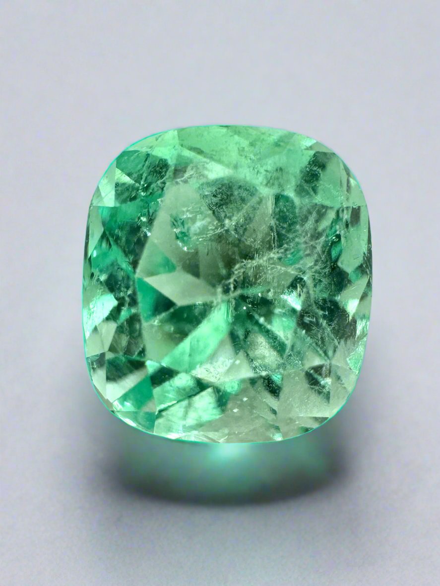 3.42 carat luminous light yellowish-green natural Colombian emerald in cushion cut, showcasing its brilliance and vibrant color.