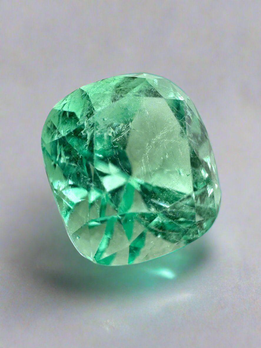 3.42 Carat natural loose Colombian emerald with cushion cut, light yellowish-green, lustrous and vibrant gemstone from JR Colombian Emeralds.