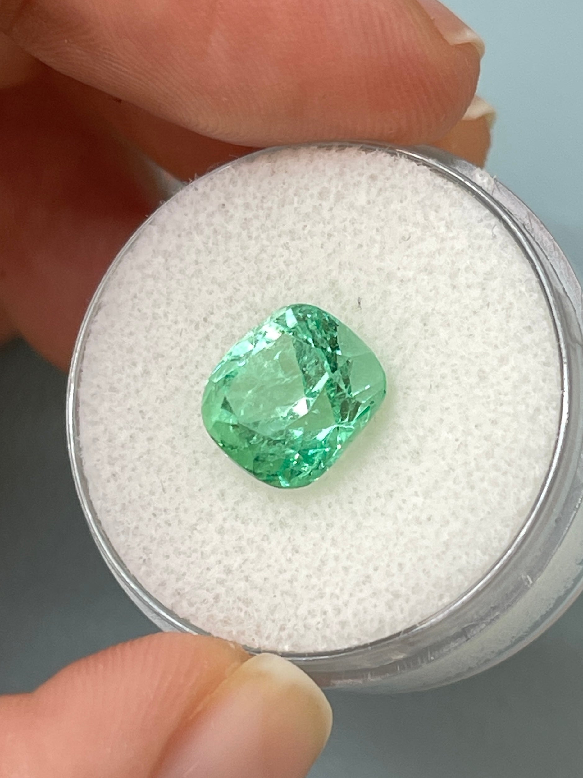 Lustrous 3.42 carat light yellowish-green natural Colombian emerald cushion cut gemstone from JR Colombian Emeralds