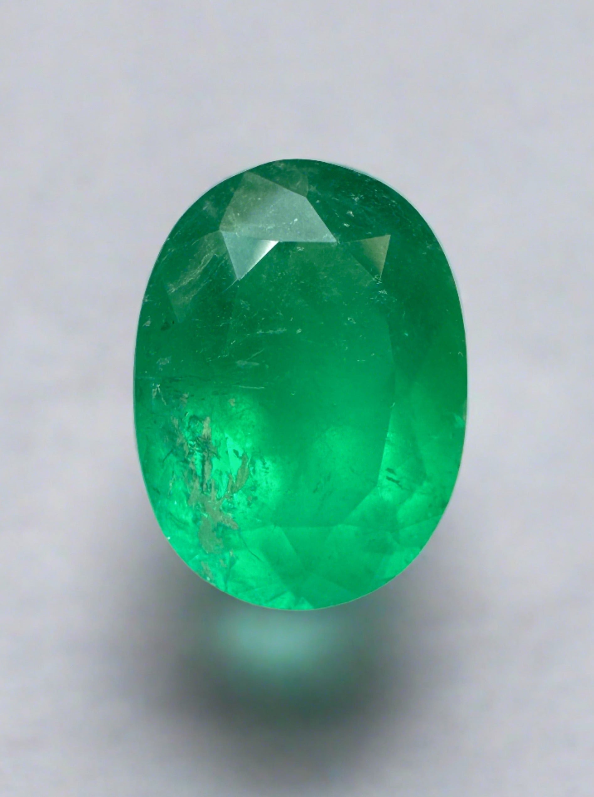 3.46 carat neon green natural Colombian emerald in oval cut, loose gemstone from JR Colombian Emeralds.