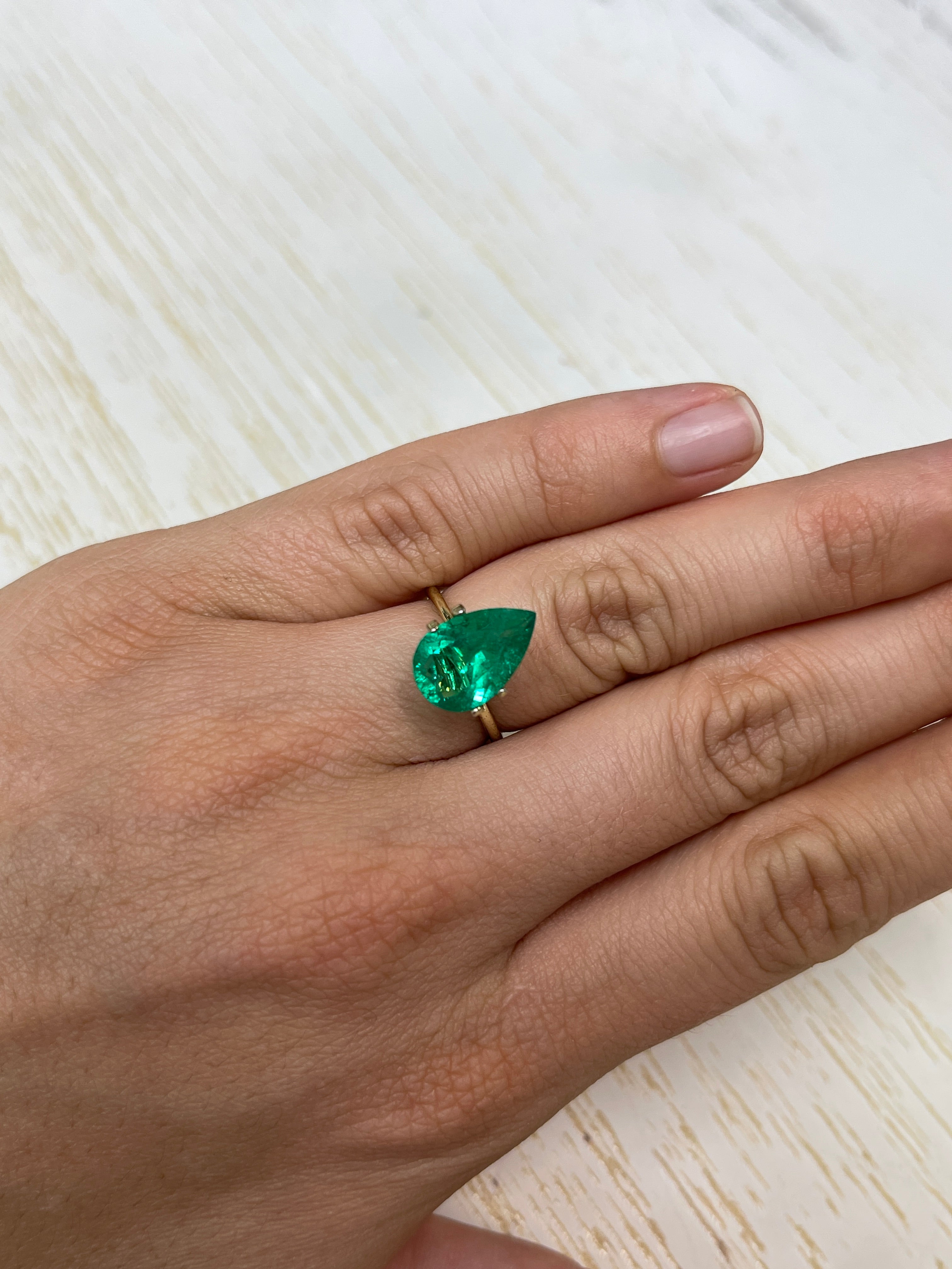 Fine 3.47 carat Colombian Emerald loose pear cut from JR Colombian Emeralds, showcasing vibrant green natural Muzo gemstone.