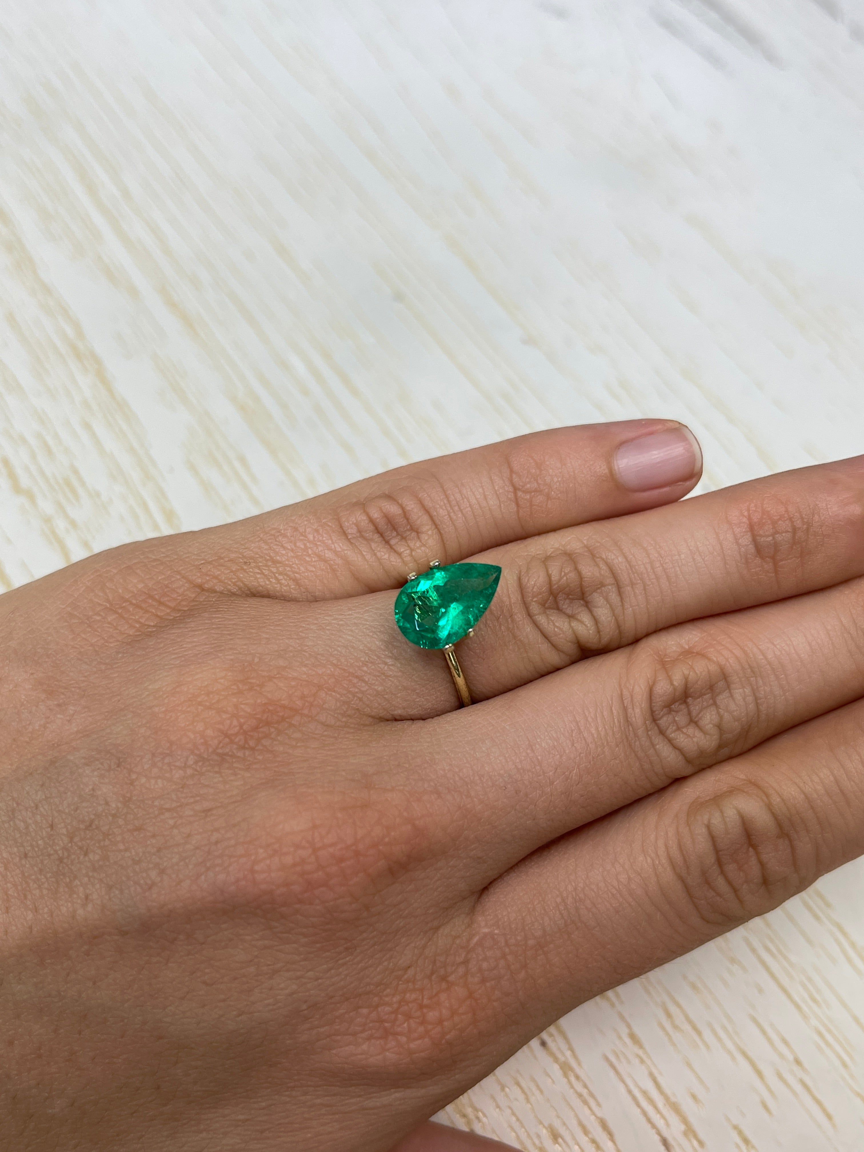 3.47 carat 14x9 mm pear-shaped Colombian Emerald loose gemstone by JR Colombian Emeralds, showcasing vibrant green color and natural clarity.