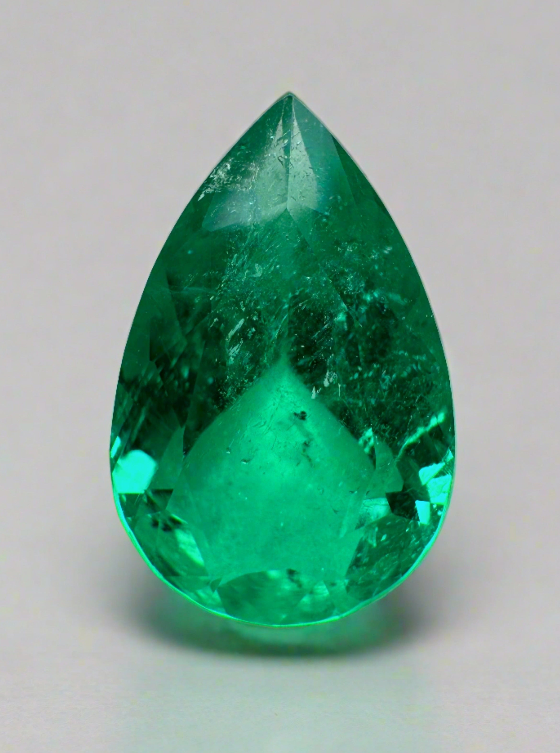 Fine 3.47 carat 14x9mm pear-cut Muzo Colombian emerald loose gemstone from JR Colombian Emeralds.