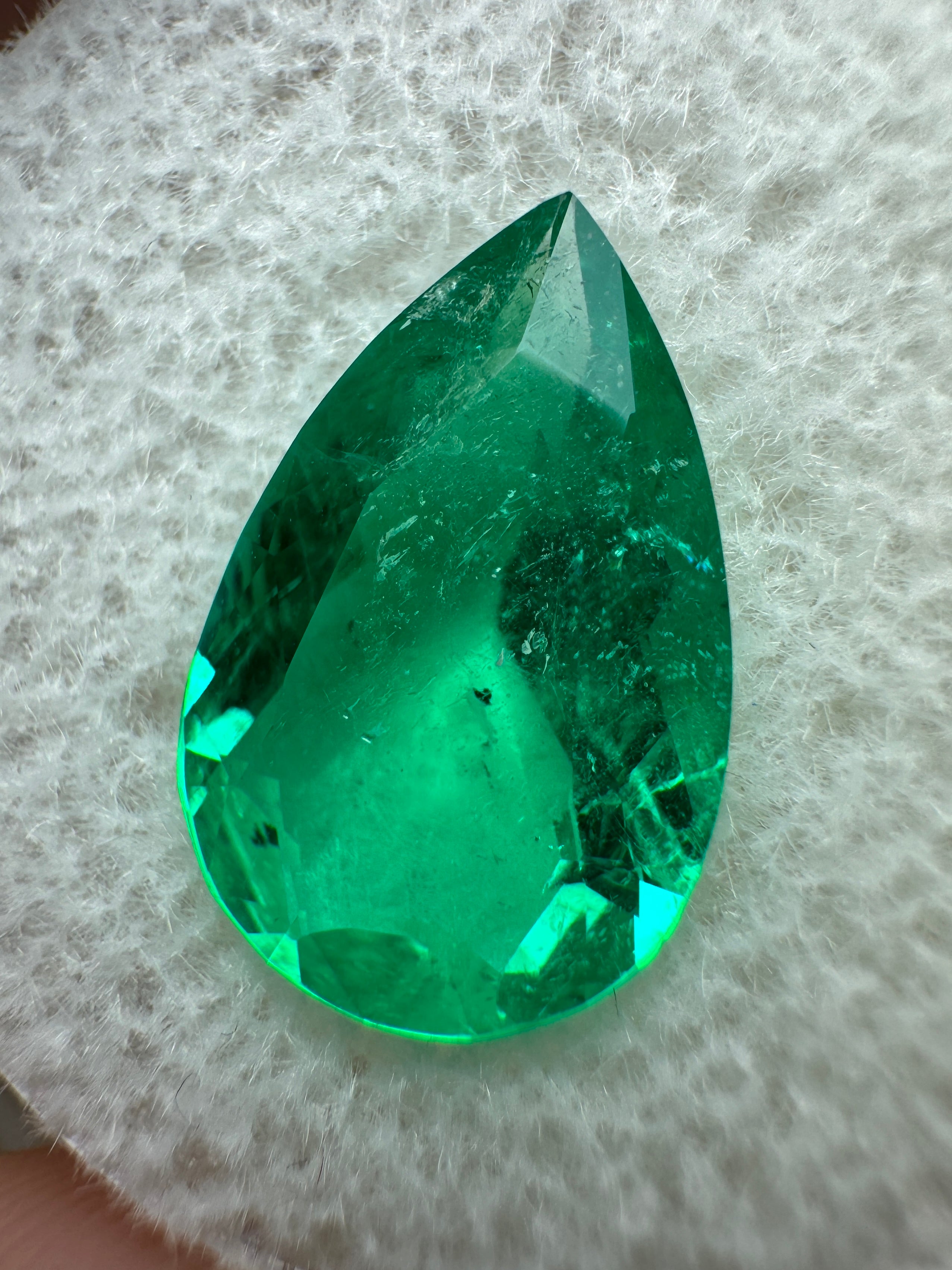 3.47 carat 14x9mm pear-cut natural Colombian Muzo emerald loose gemstone with vibrant green color and fine quality.