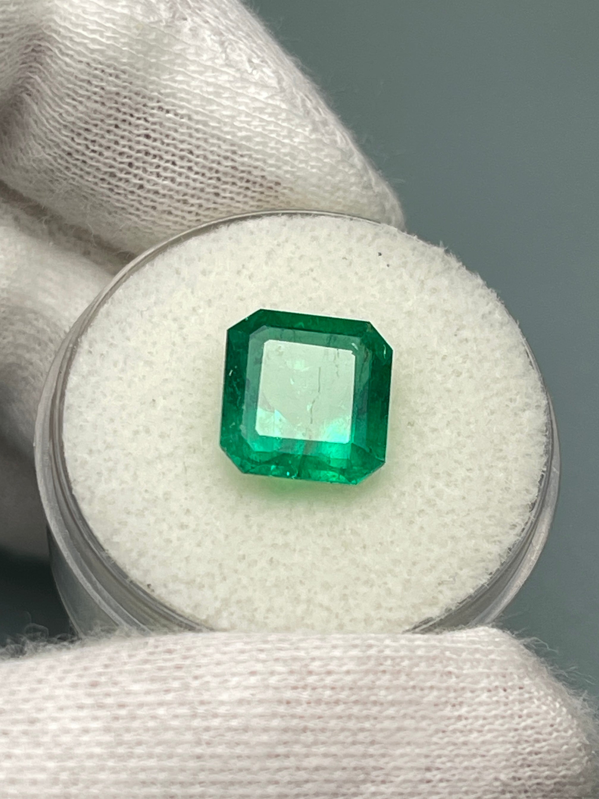 Vivid 3.49 Carat Muzo green Colombian emerald loose gemstone in an Asscher cut, showcasing vibrant natural color and clarity.