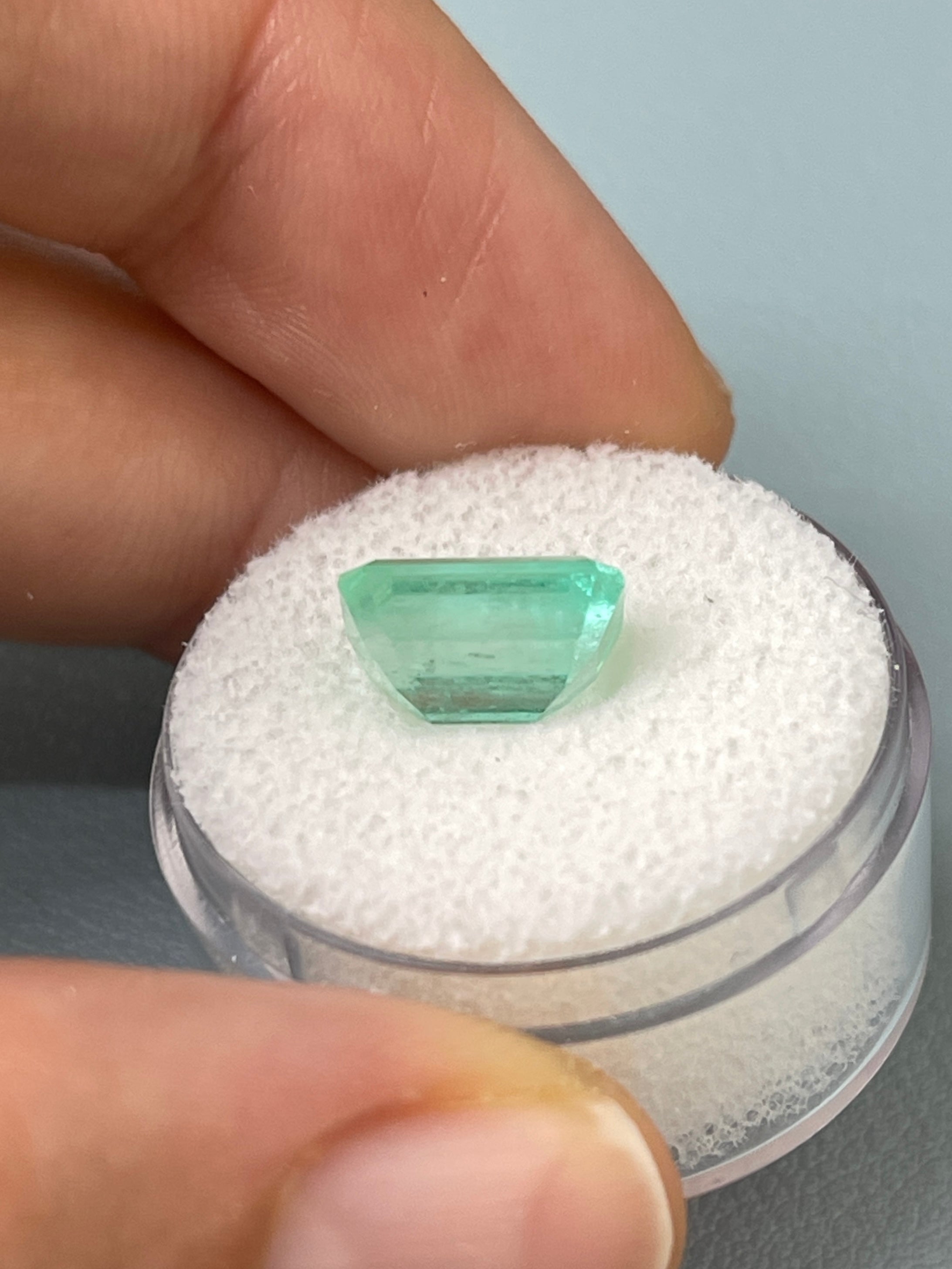 Seafoam green 3.54 carat natural Colombian emerald loose gemstone in an emerald cut, showcasing vibrant color and clarity.