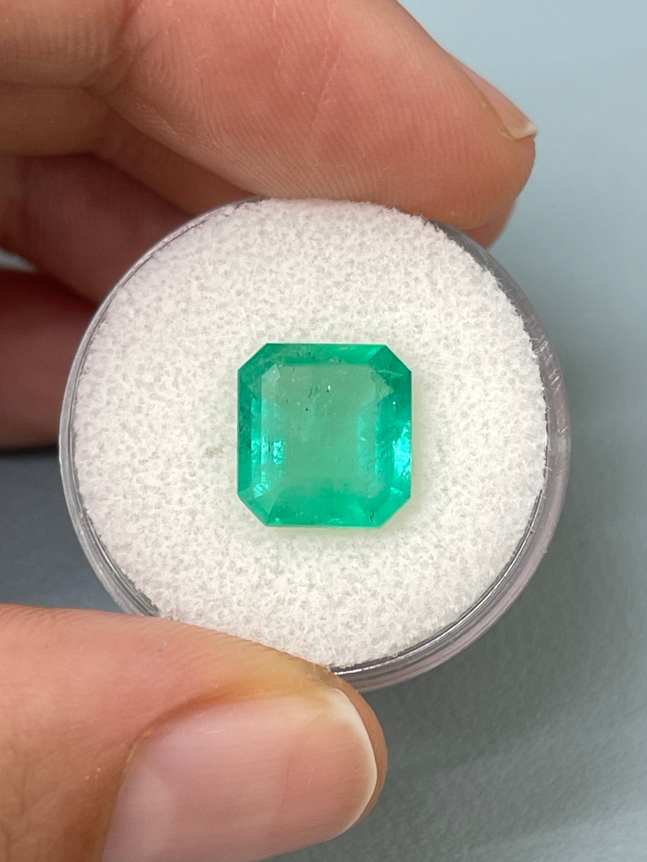 Sping green 3.59 carat Colombian emerald loose Asscher cut gemstone with vibrant color and clarity.