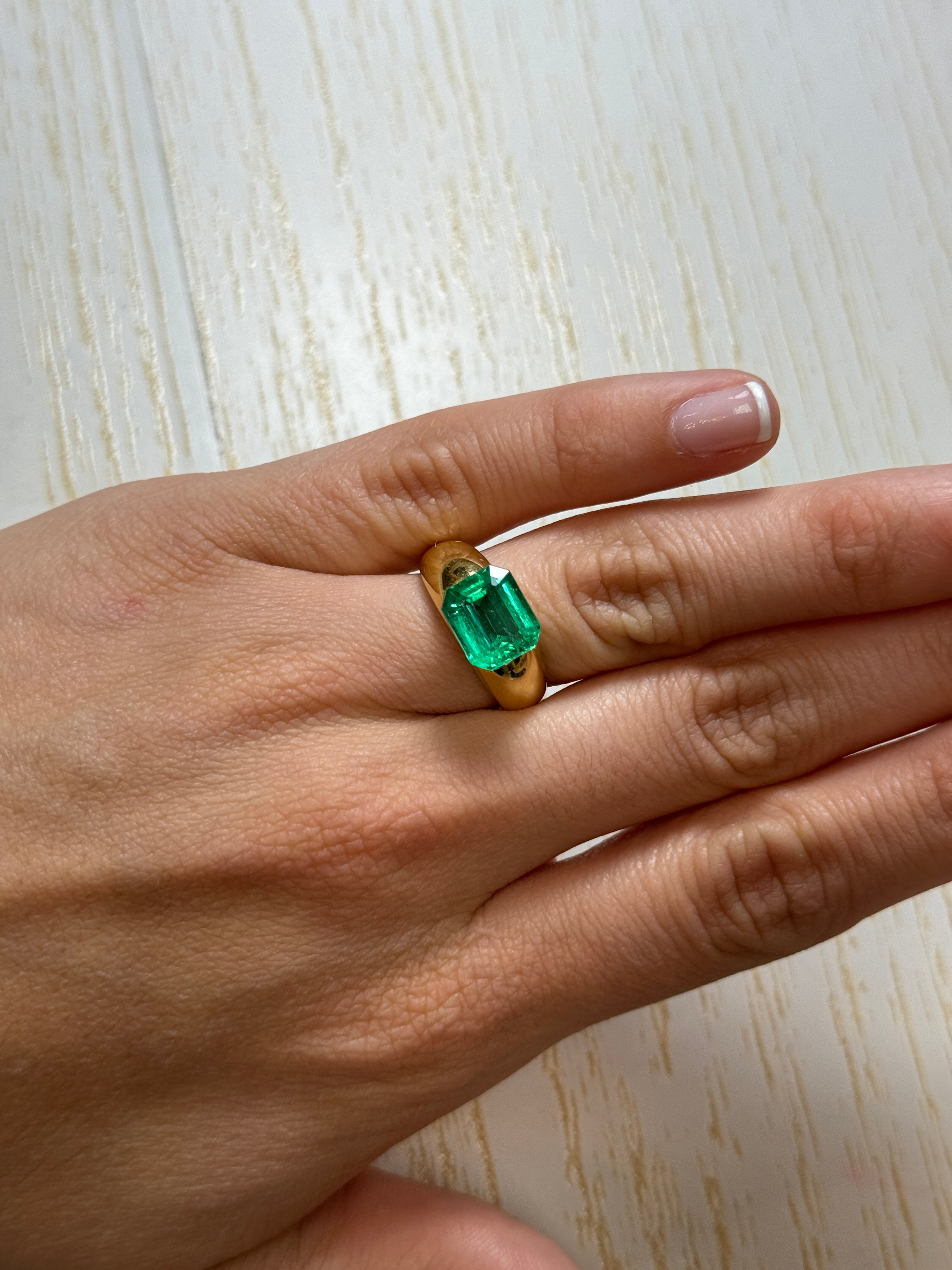 3.61 carat natural Colombian emerald loose gemstone with vibrant green color and emerald cut, from JR Colombian Emeralds.