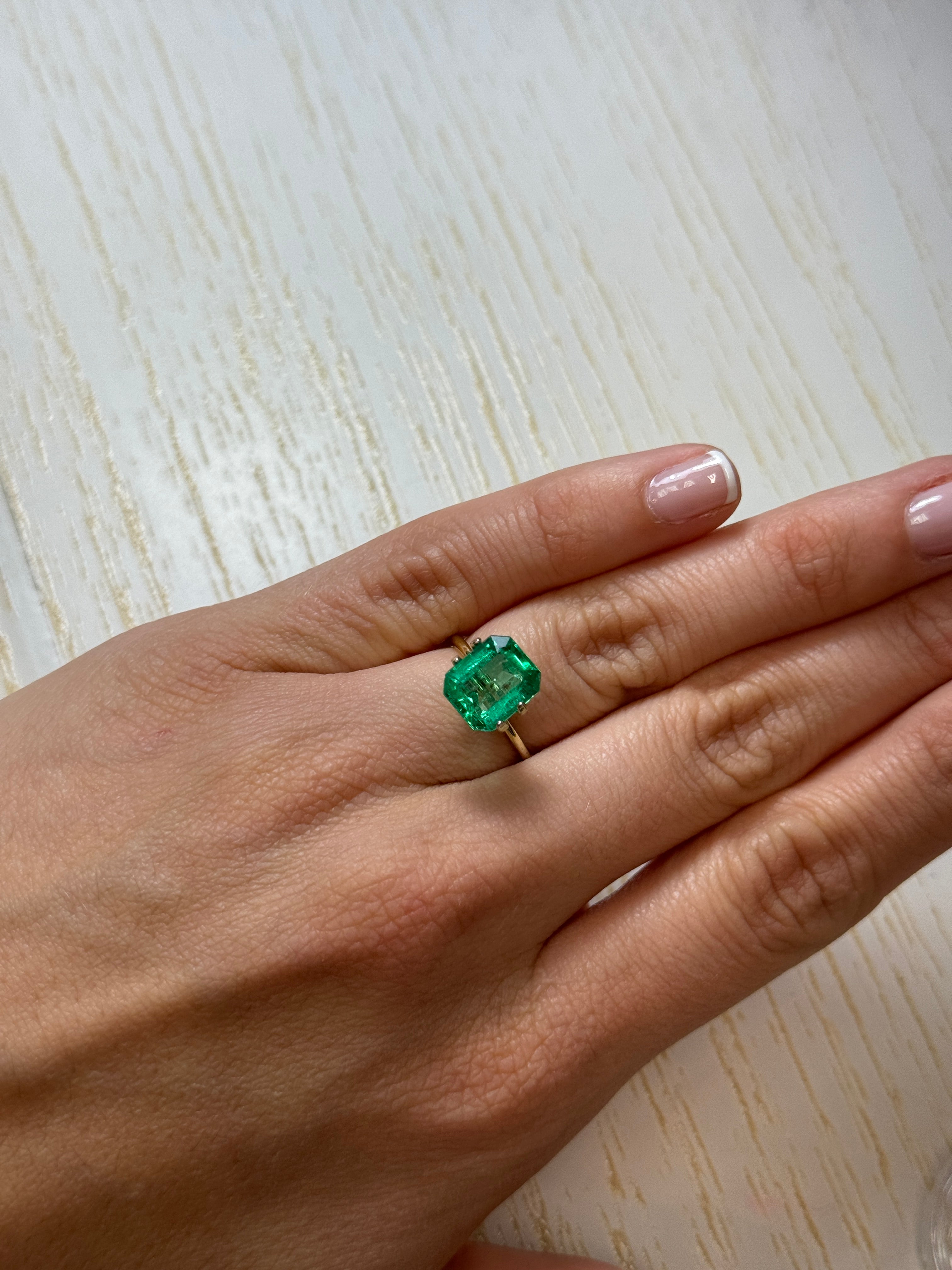 3.61 carat natural Colombian emerald cut loose emerald from JR Colombian Emeralds, vibrant green color and faceted gemstone.