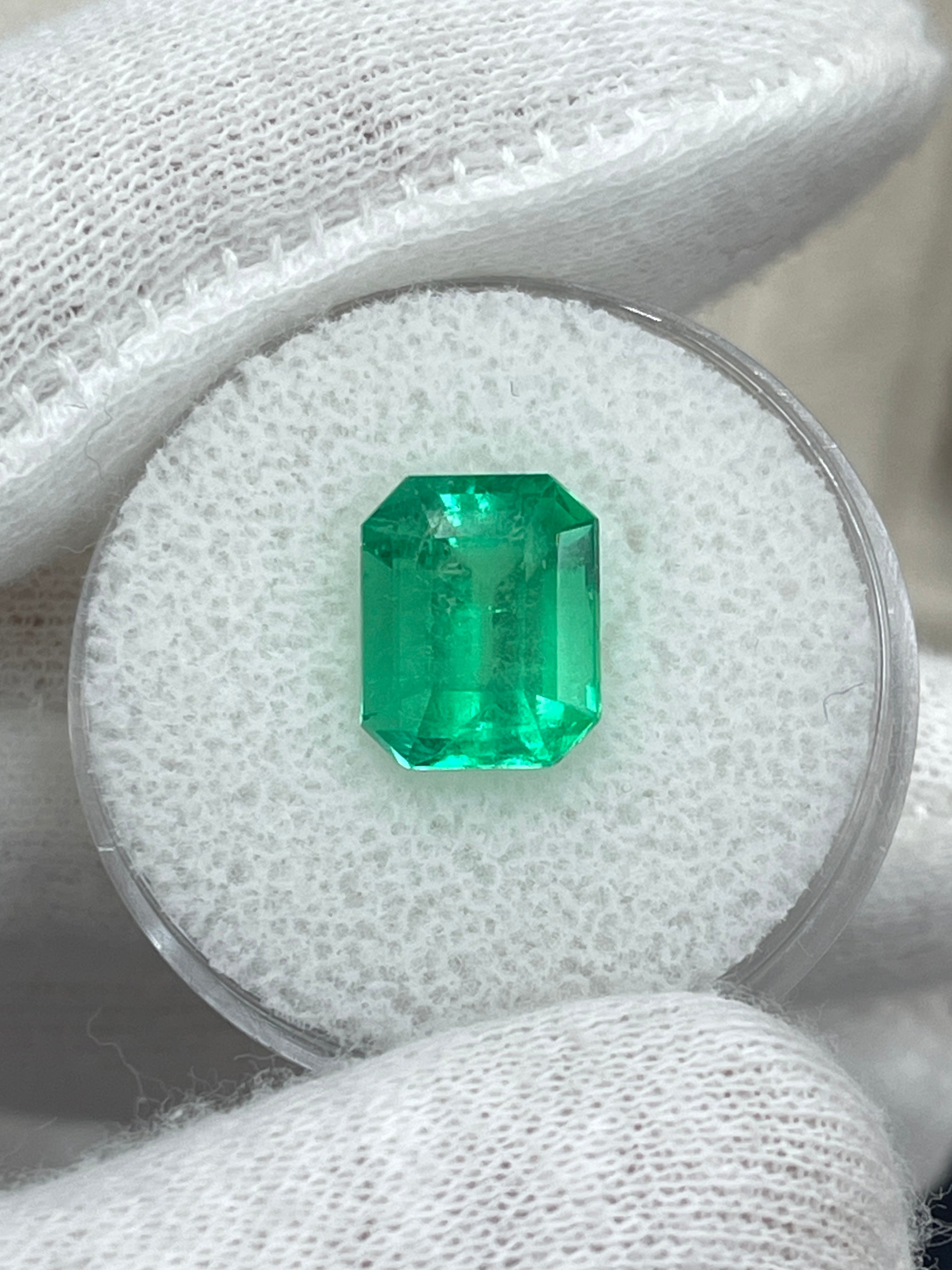 3.64 carat yellowish green natural Colombian emerald in an emerald cut, showcasing clarity and vibrant color, from JR Colombian Emeralds.