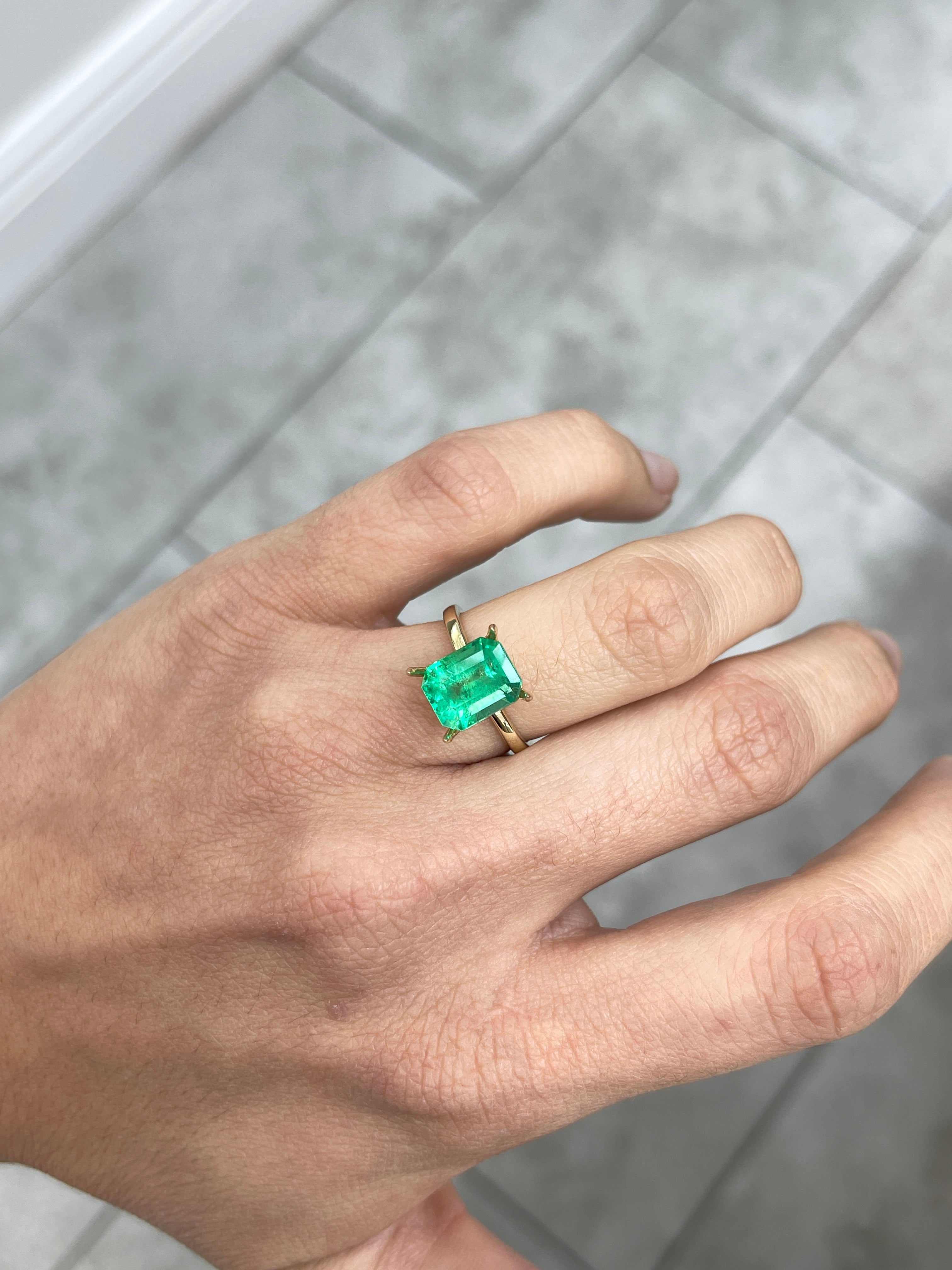 Yellowish green 3.64 carat natural Colombian emerald in emerald cut, loose gemstone from JR Colombian Emeralds.