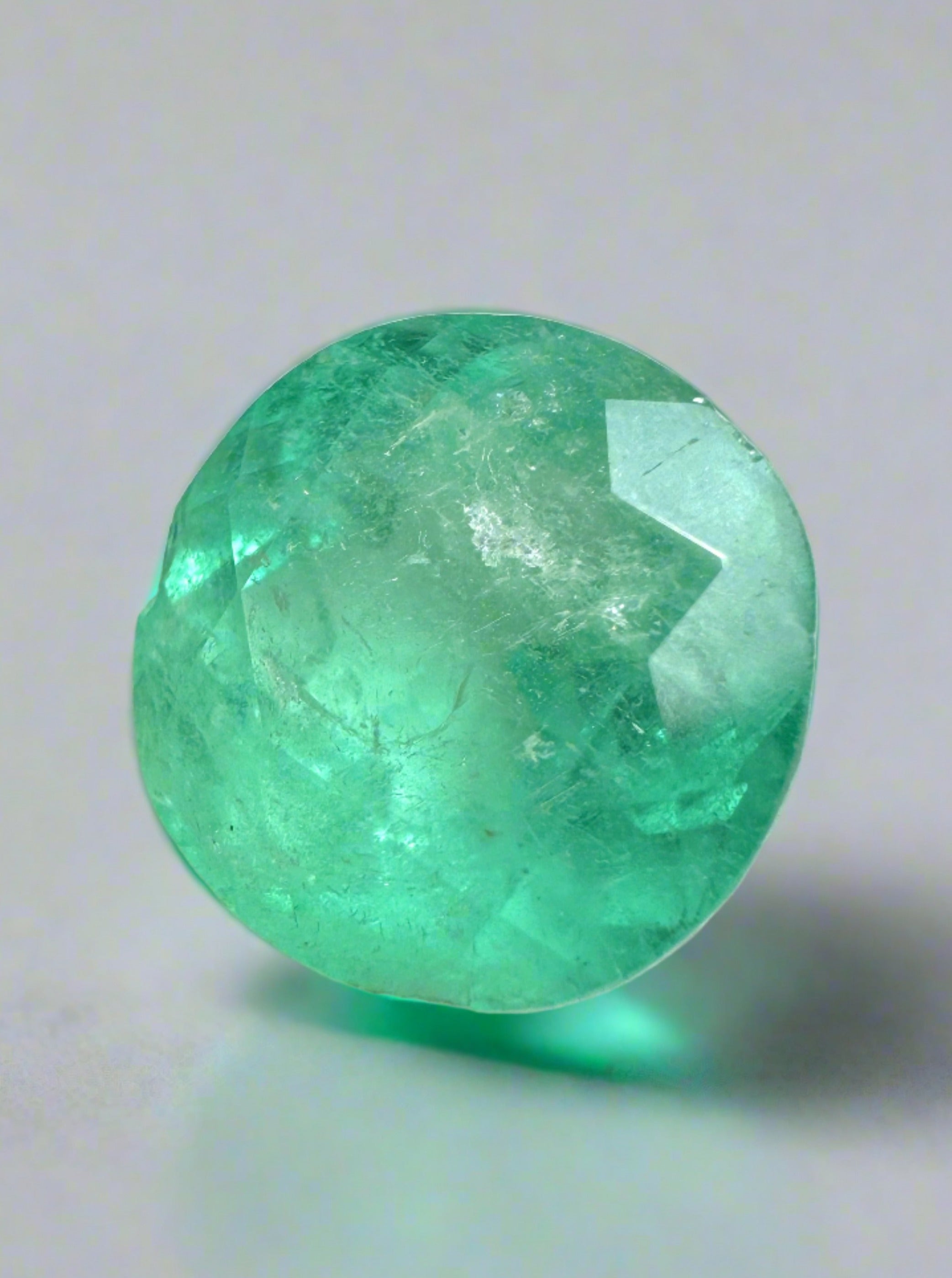Natural green 3.65 carat round Colombian emerald loose gemstone from JR Colombian Emeralds, showcasing vibrant color and clarity.