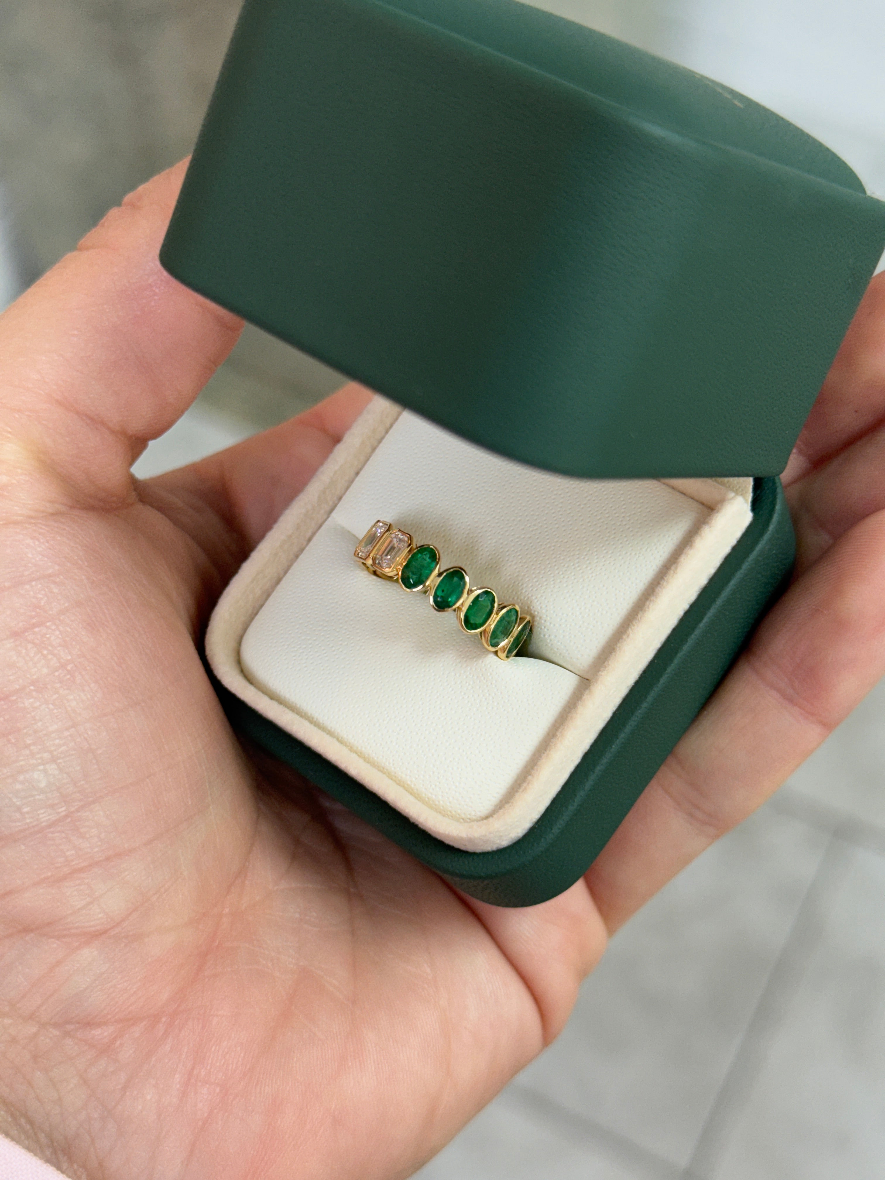 18K gold eternity band with 3.65tcw undecided half oval emerald and half emerald cut diamond, size 6.5, by JR Colombian Emeralds.