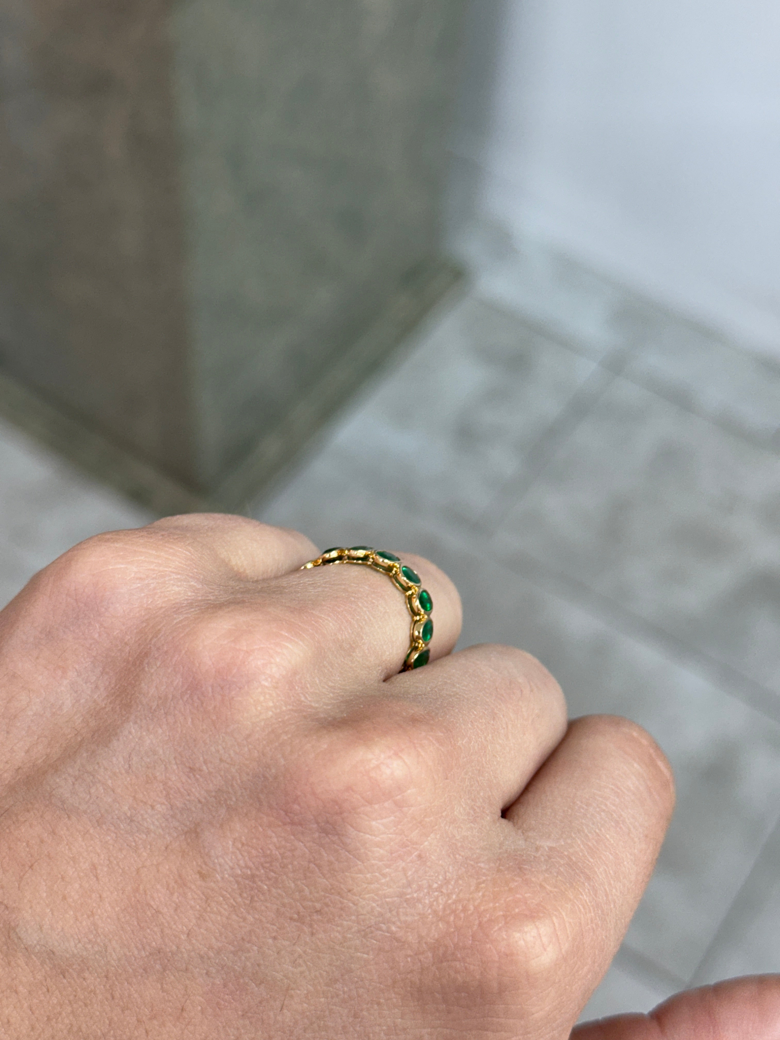 JR Colombian Emeralds eternity band with 3.65tcw half oval emeralds and half emerald cut diamonds in 18K gold, size 6.5.