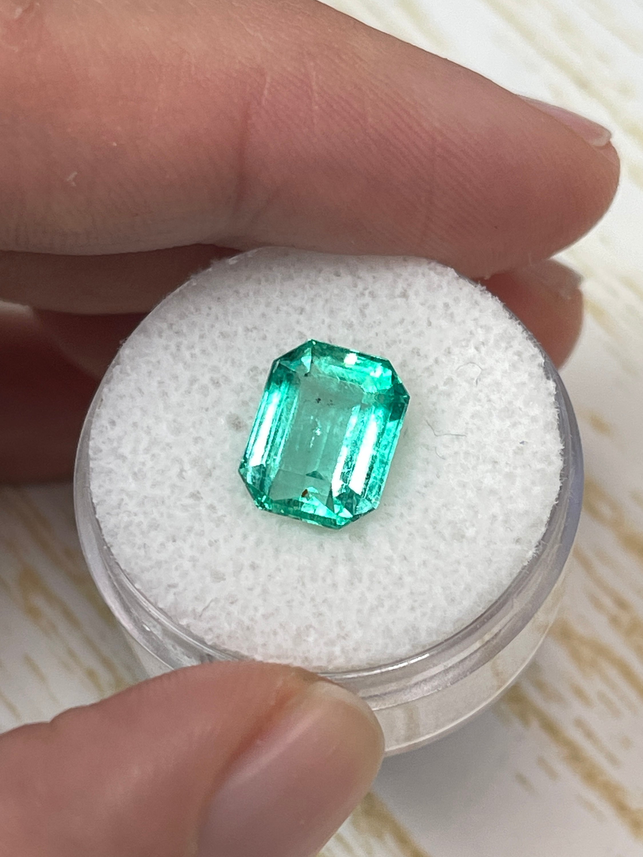 Natural 3.76 carat transparent green Colombian emerald loose gemstone in emerald cut, showcasing vivid color and clarity.