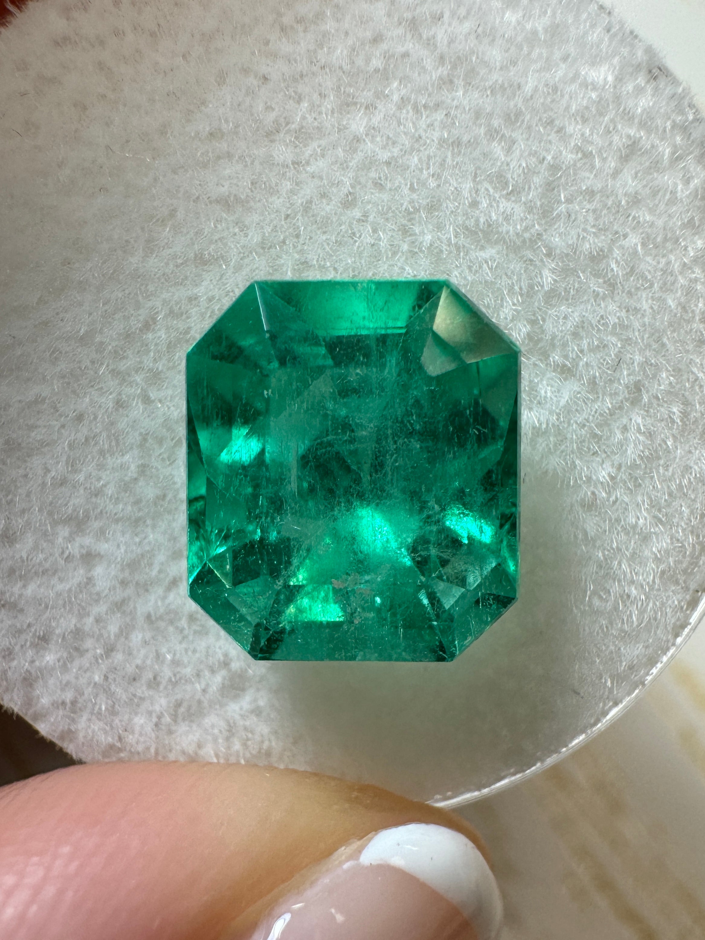 Glowing 3.80 carat natural Colombian emerald loose gemstone in 10x9 emerald cut, bright green color, from JR Colombian Emeralds