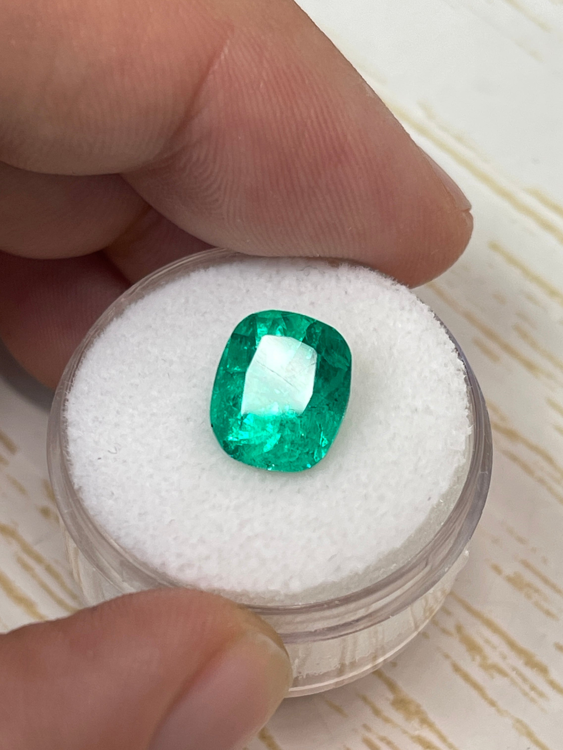 3.84 carat intense medium green Colombian emerald loose cushion cut gemstone from JR Colombian Emeralds, natural and faceted.