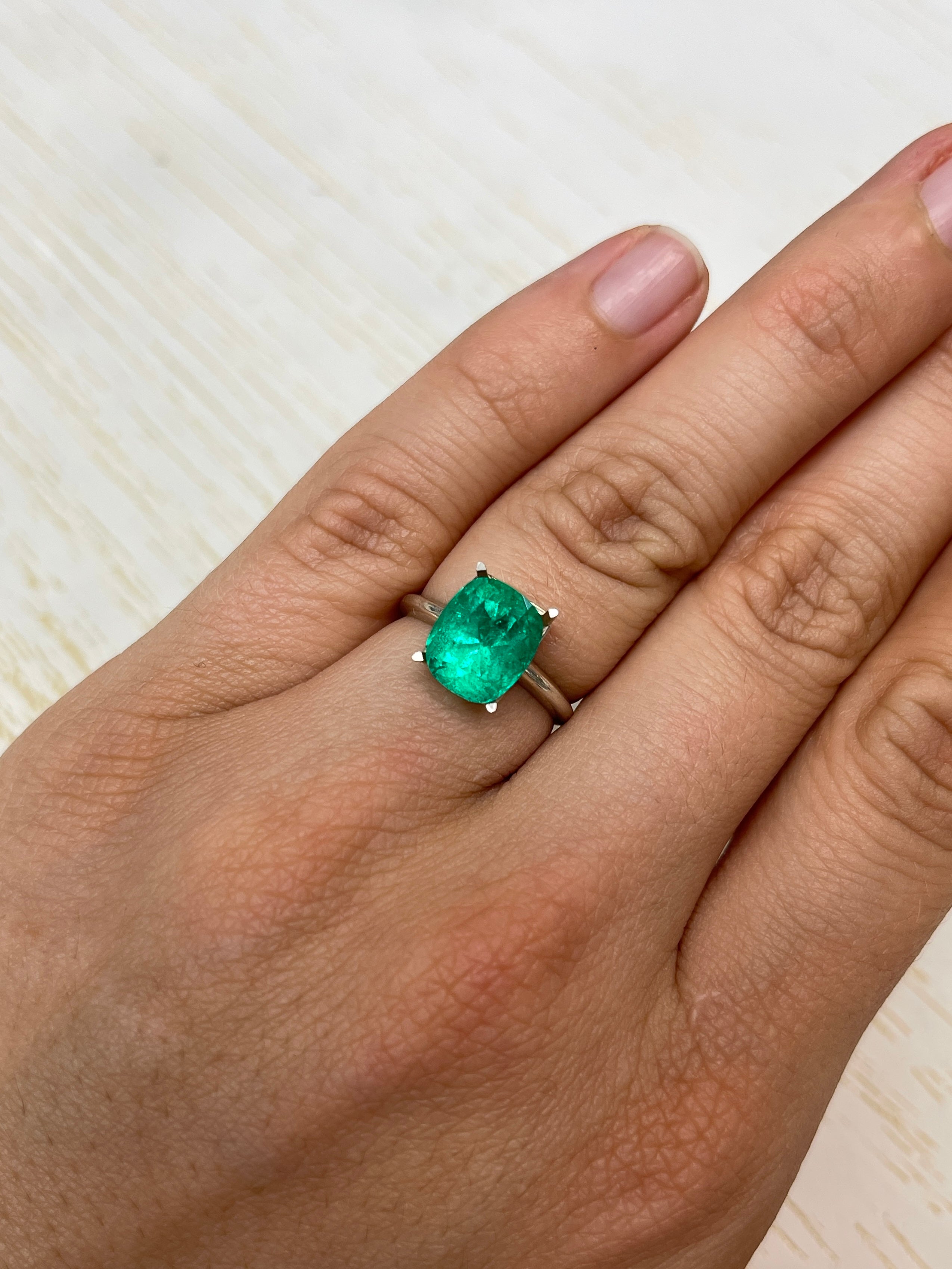 Natural loose Colombian emerald, 3.84 carats, cushion cut, intense medium green, from JR Colombian Emeralds.