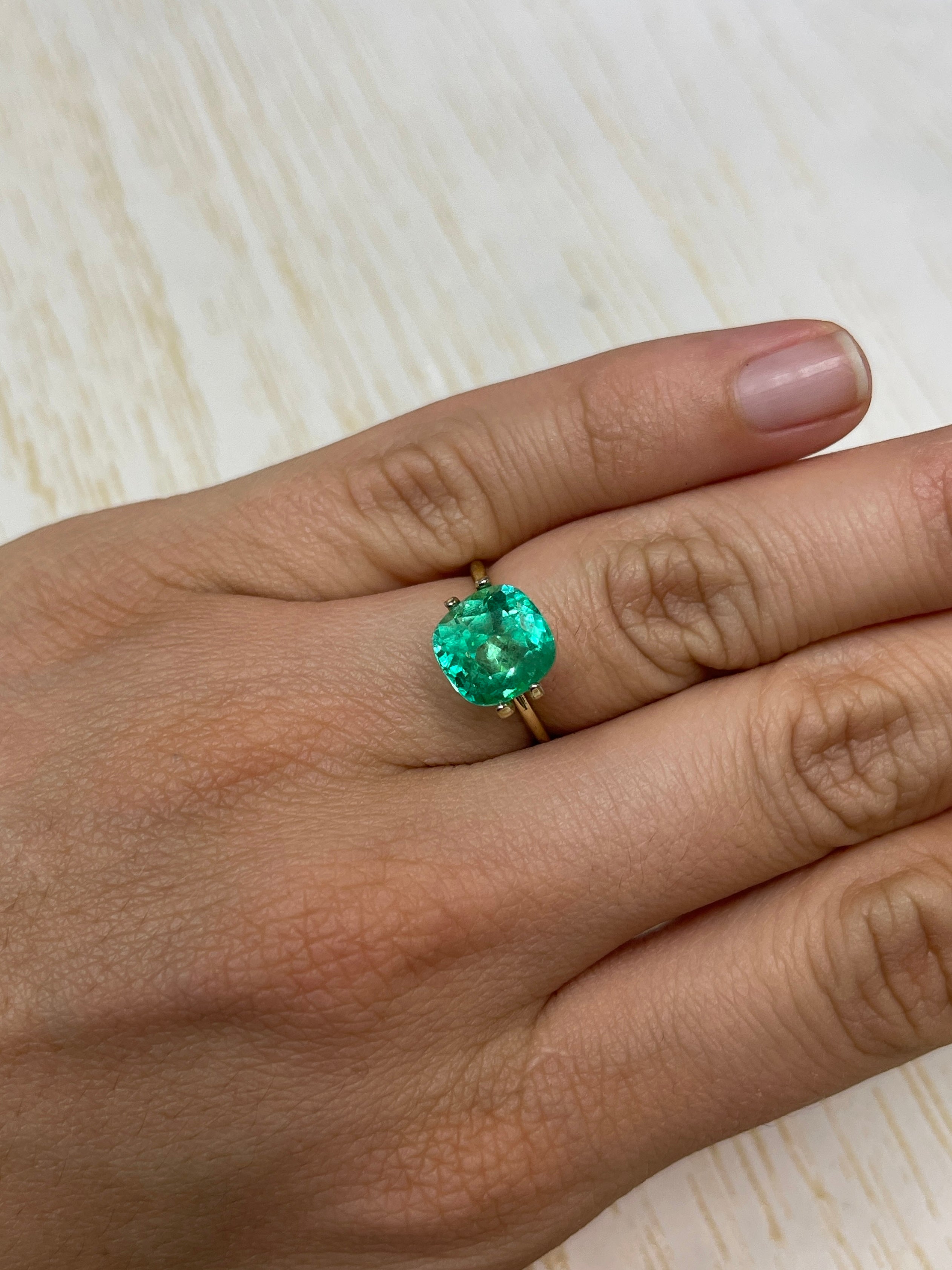 Bright yellowish green 3.85 carat Colombian emerald in cushion cut, natural loose gemstone from JR Colombian Emeralds.