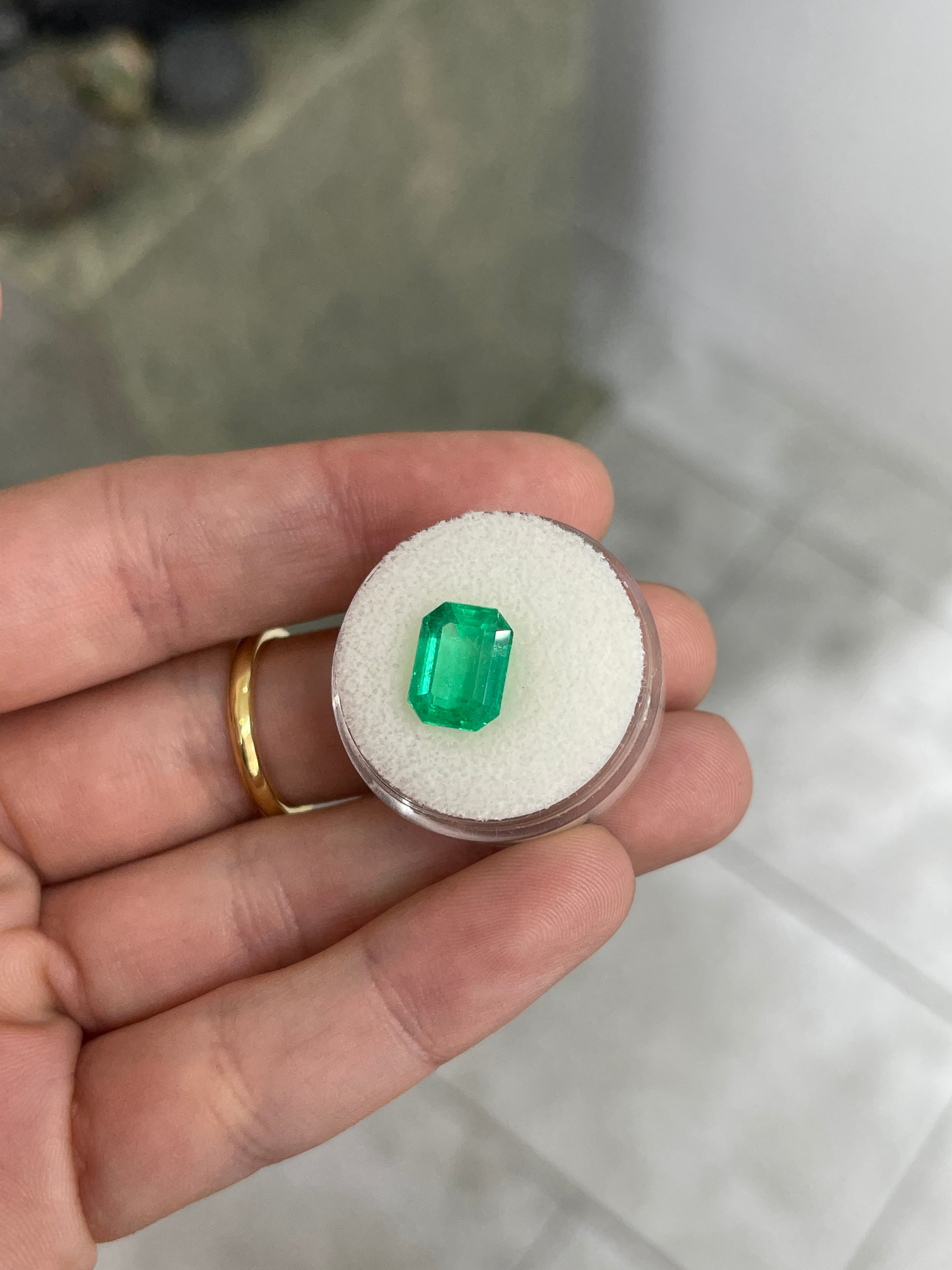 Natural 3.88 carat green Colombian emerald loose gemstone, emerald cut, glowing and vibrant with rich green color.