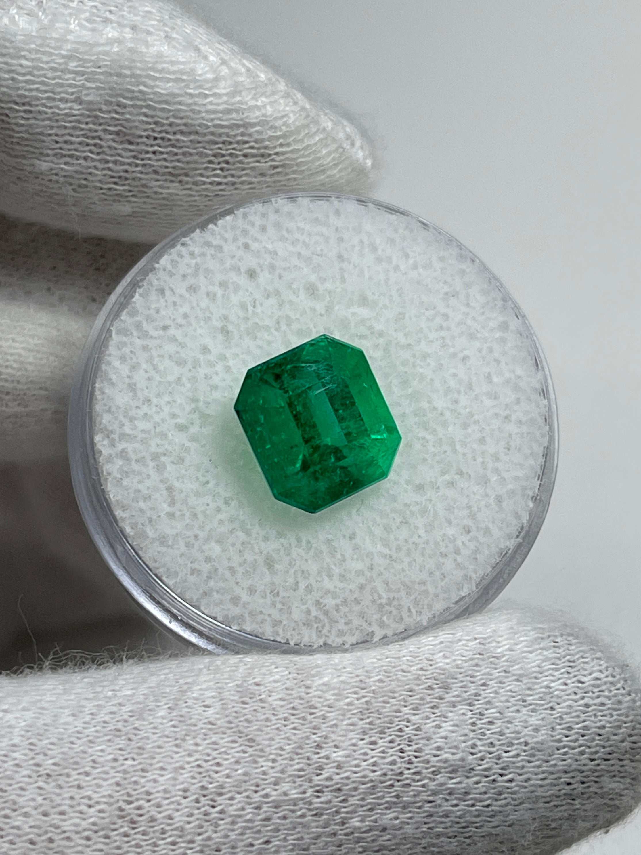 Vivid 3.90 Carat AAA Colombian Emerald loose gemstone with emerald cut, showcasing vibrant green color and natural clarity.