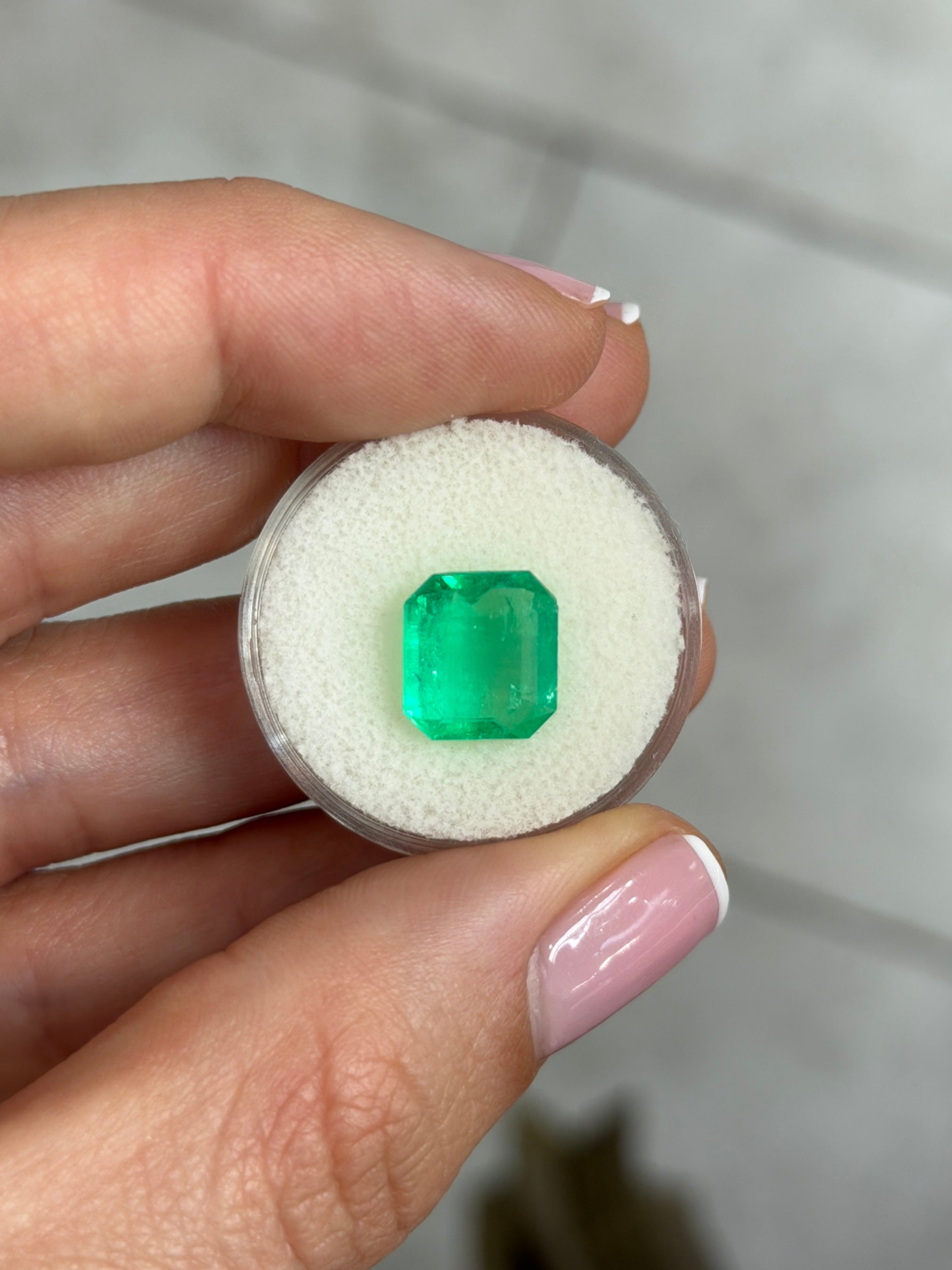 3.94 carat yellowish green natural Colombian emerald loose gemstone in Asscher cut, from JR Colombian Emeralds.