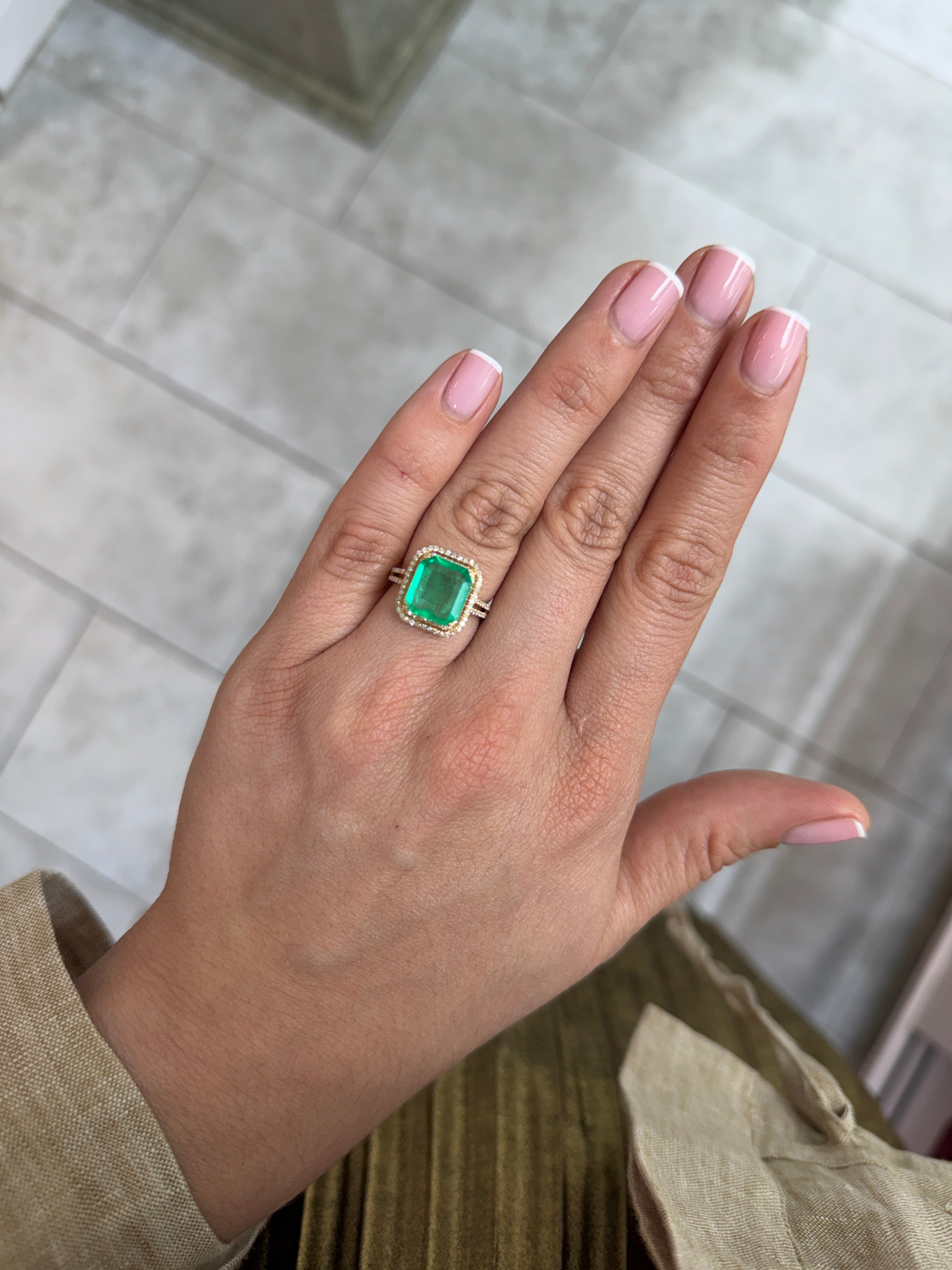 3.94 carat yellowish green natural Colombian emerald loose Asscher cut gemstone, showcasing clarity and vibrant color.