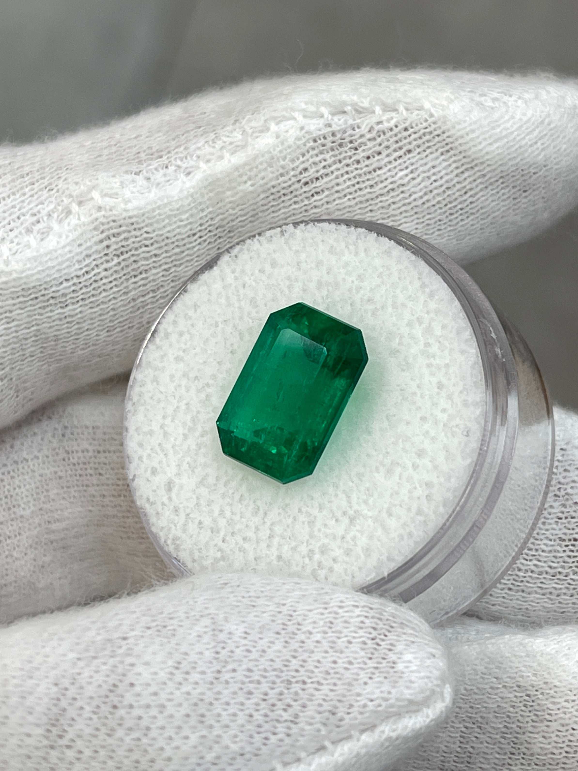 Vivid green 3.95 carat emerald cut Colombian emerald, GIA certified, loose gemstone with bright clarity and rich color from JR Colombian Emeralds.