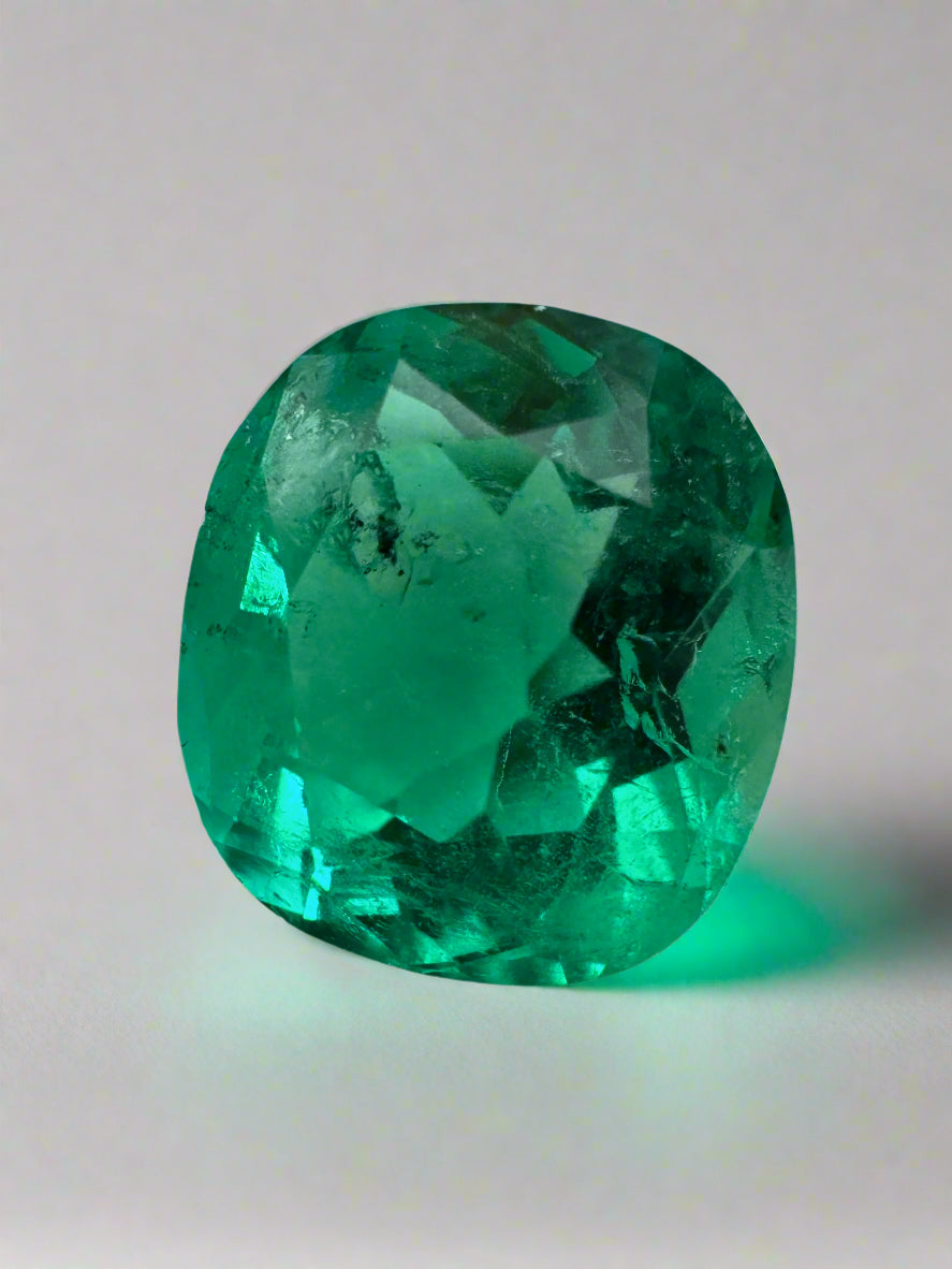 Vivid bluish green 4.96 carat cushion cut loose emerald with natural freckles from JR Colombian Emeralds