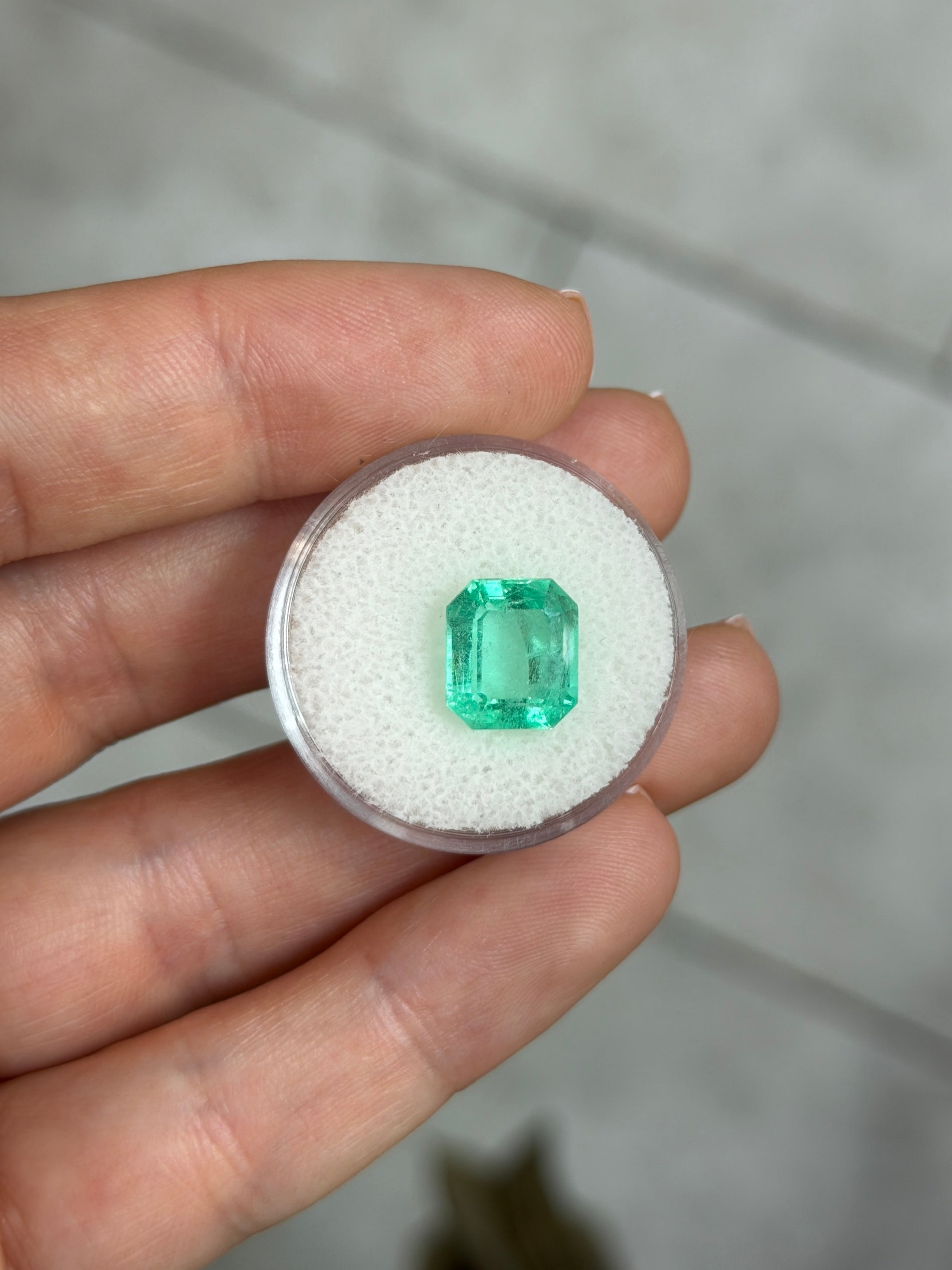 4.12 carat medium light bluish green Colombian emerald loose gemstone with chunky emerald cut, natural and vibrant color.