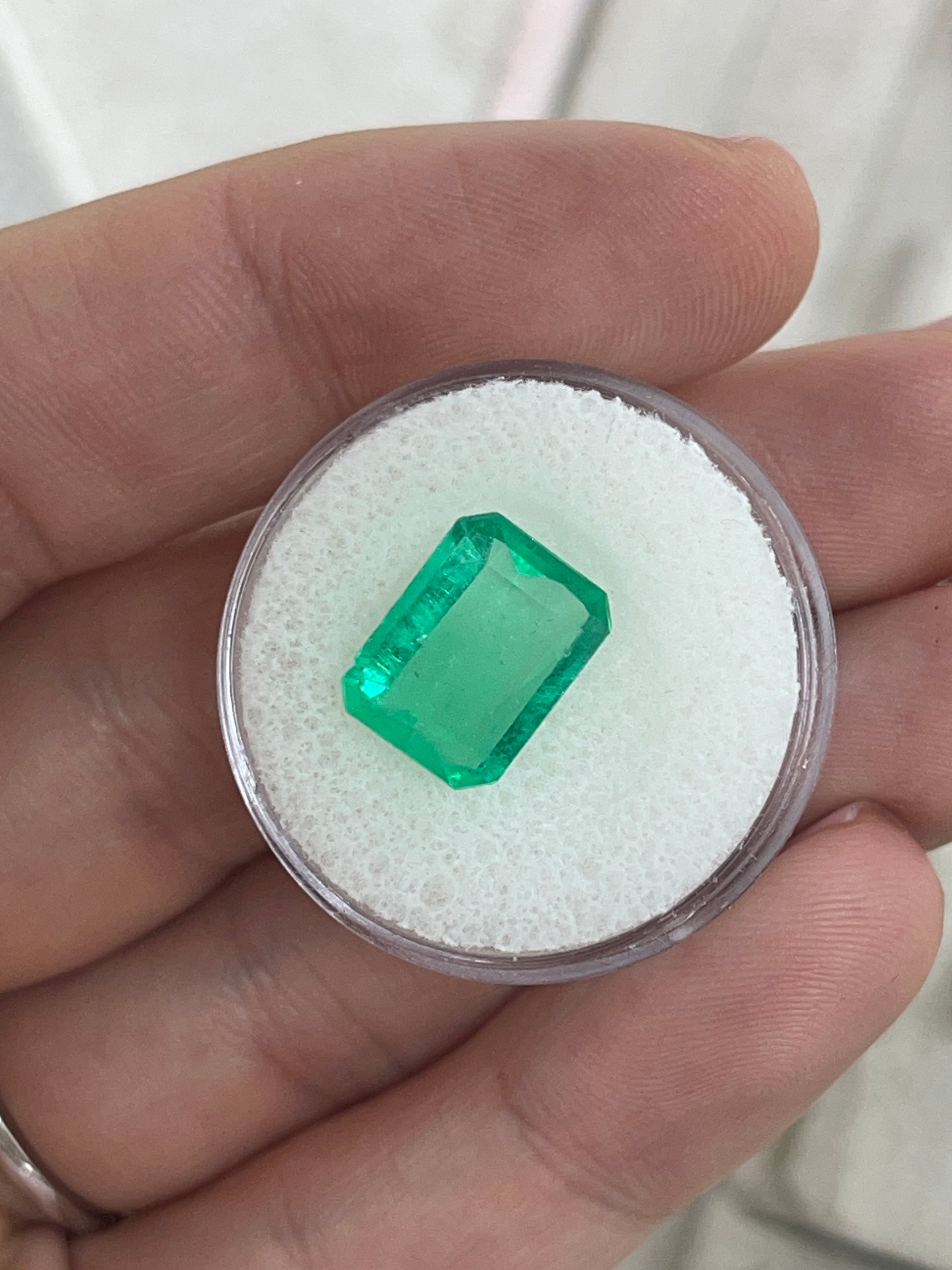 4.12 carat natural Colombian emerald loose gemstone in 12x9mm portrait cut with emerald facets, from JR Colombian Emeralds.