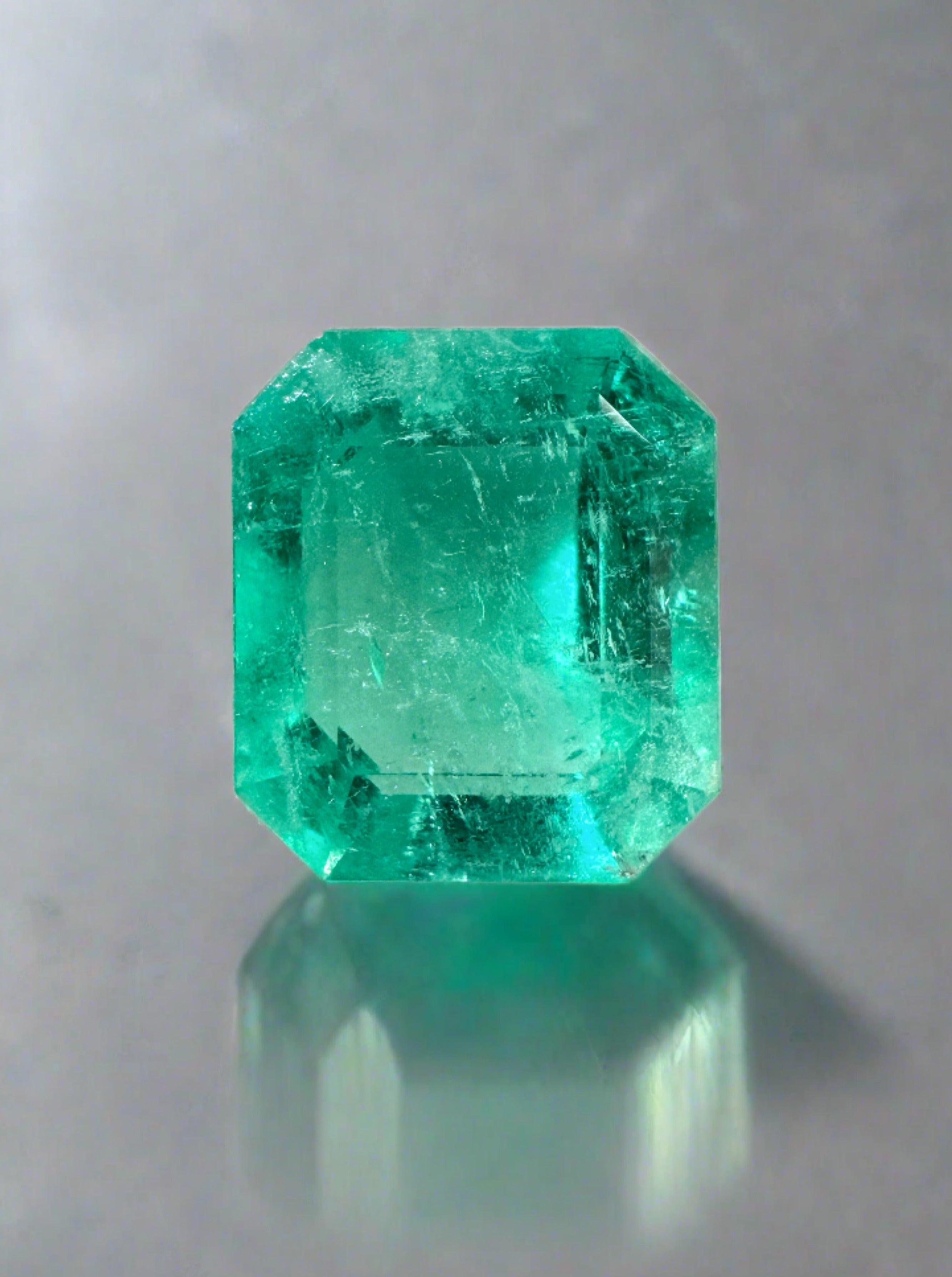 Bluish green 4.17 carat natural Colombian emerald in classic emerald cut, showcasing deep color and clarity.