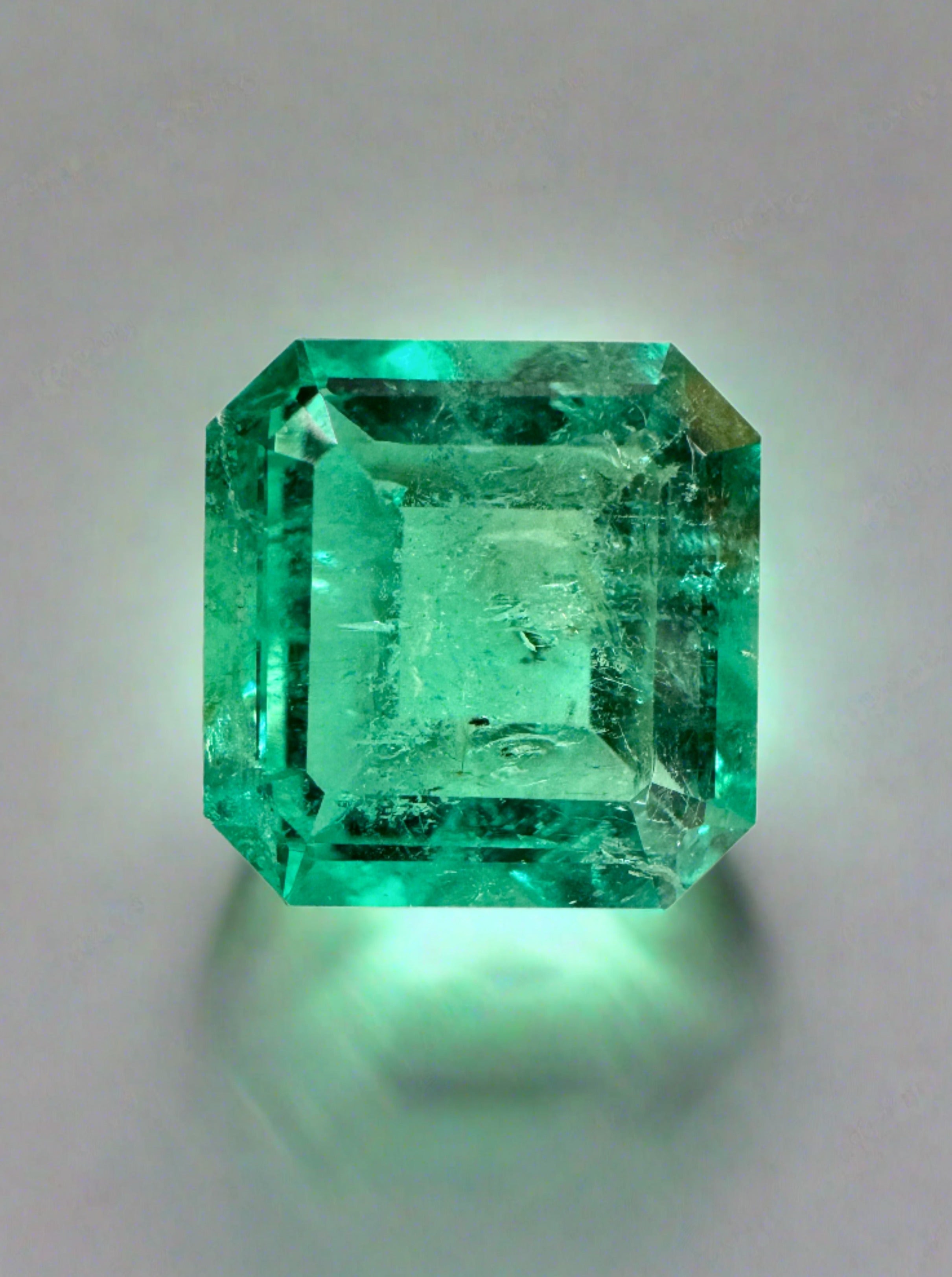 Vibrant 4.33 carat loose Colombian emerald Asscher cut gemstone from JR Colombian Emeralds, showcasing rich green color and clarity.