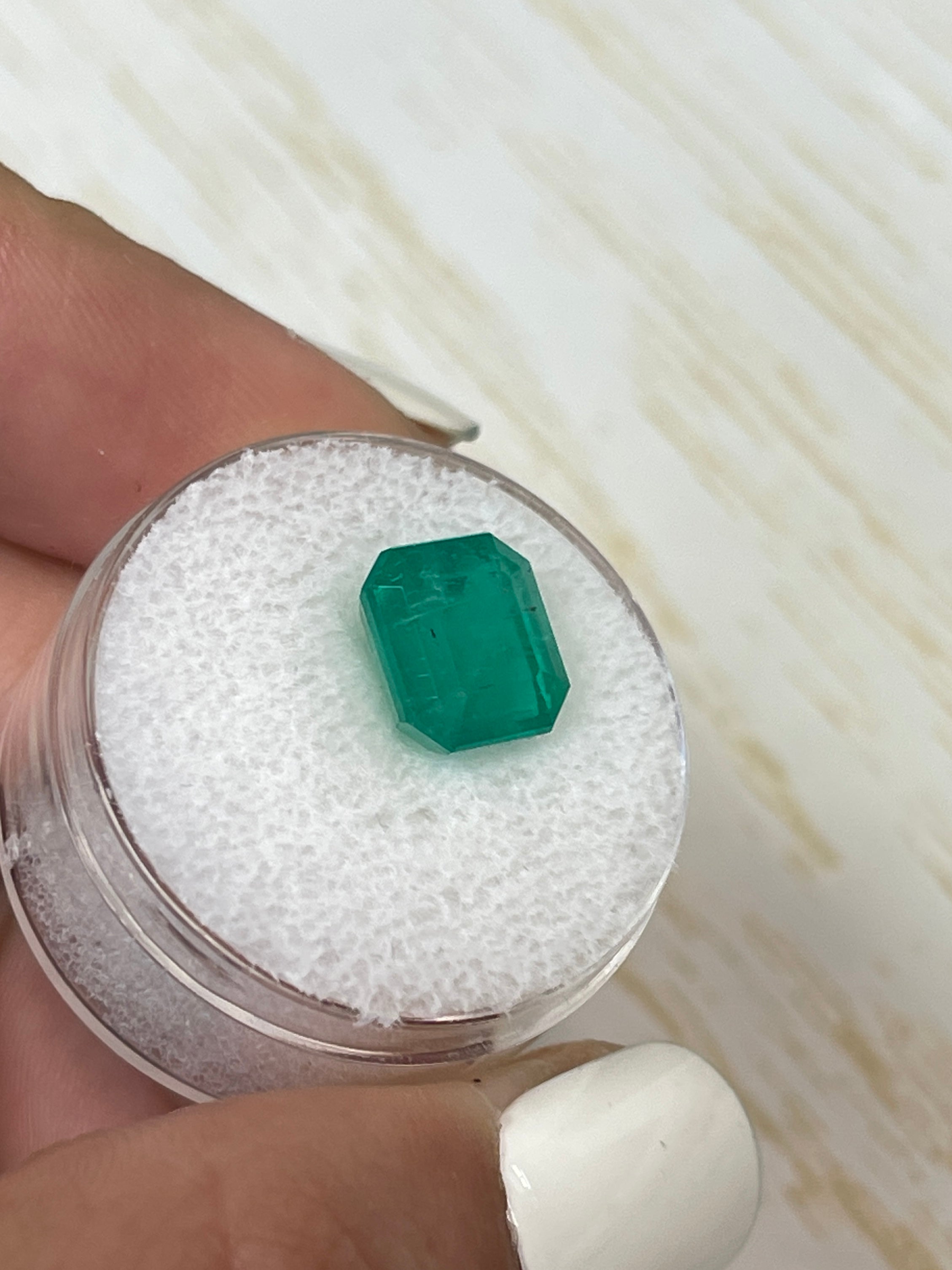 Forest green Colombian emerald, 4.34 carats, Asscher cut, from JR Colombian Emeralds, showcasing vibrant color and clarity.