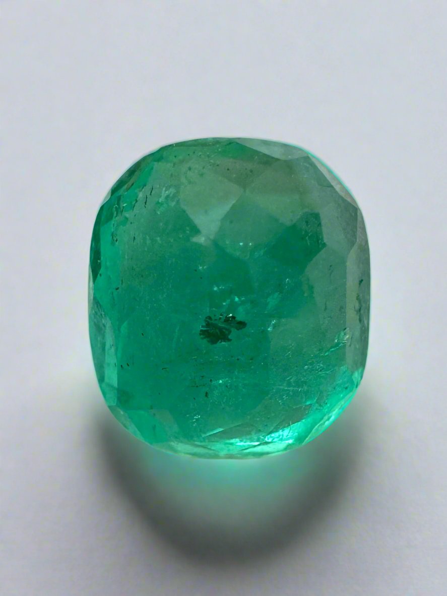 Deep green 4.37-carat Colombian emerald loose gemstone, cushion cut with natural freckled pattern, from JR Colombian Emeralds.