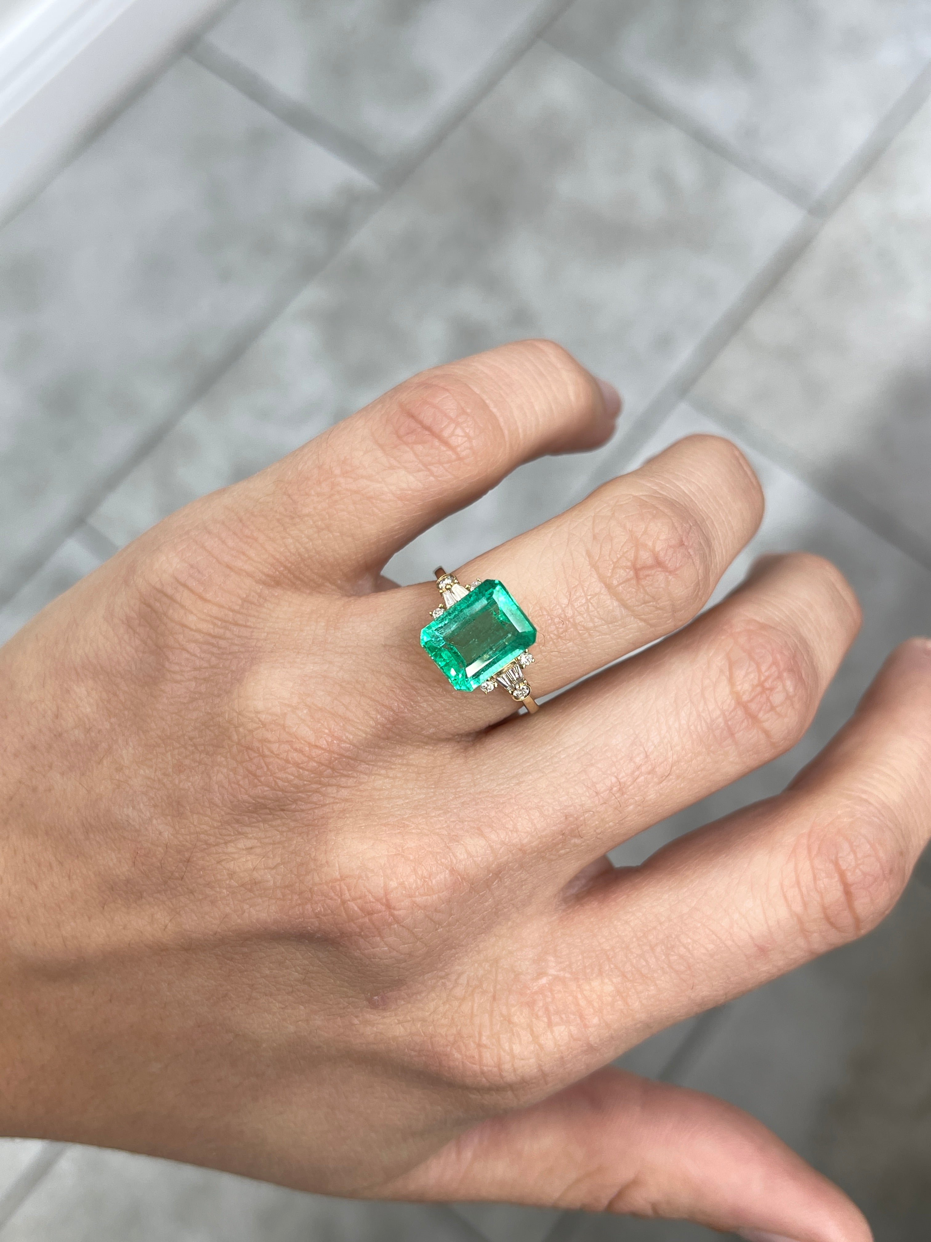 4.43 carat Jyotish green natural Colombian emerald in an emerald cut, showcasing vibrant color and clarity, by JR Colombian Emeralds.