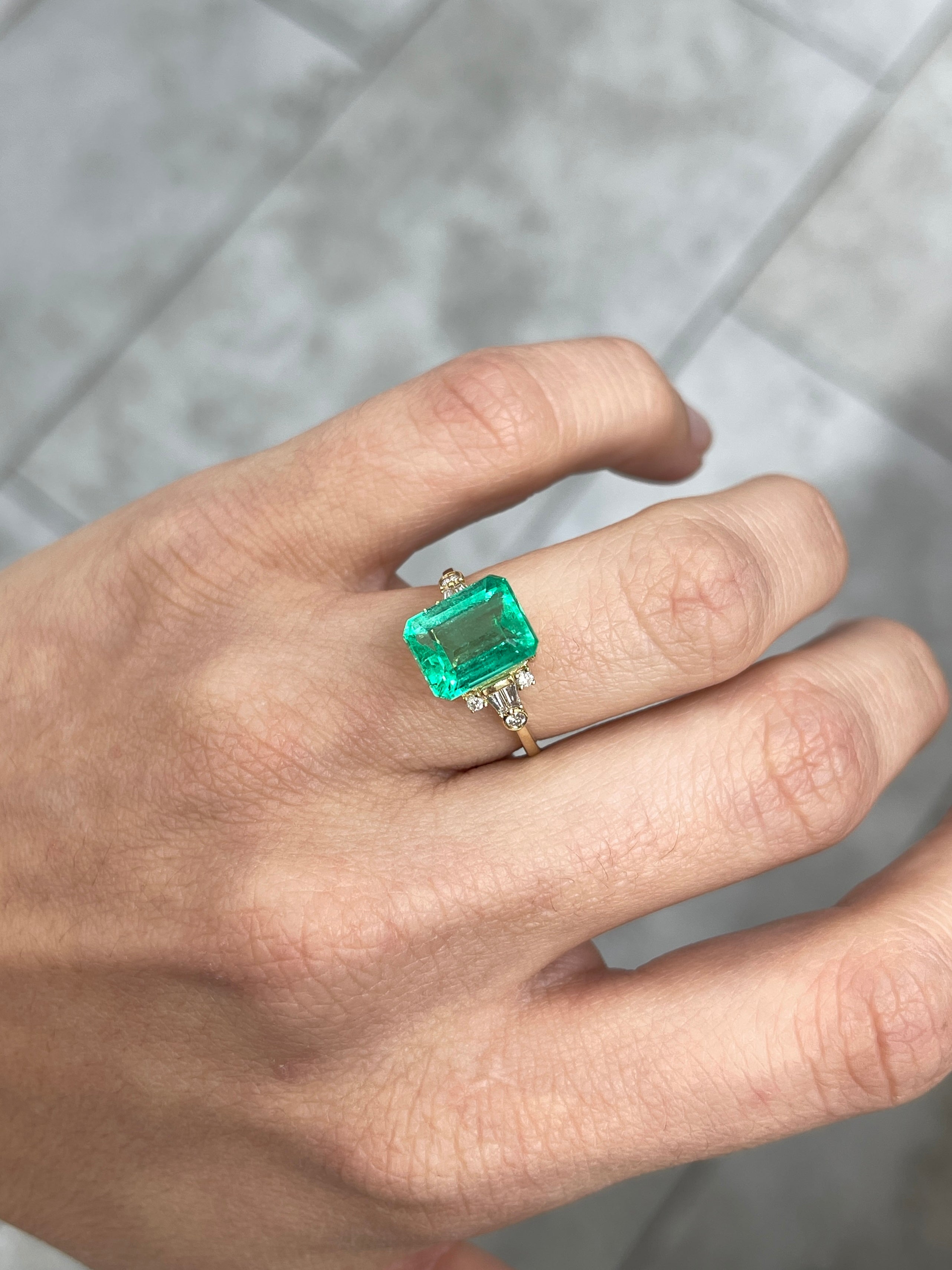 Natural 4.43 carat Jyotish green Colombian emerald loose gemstone with emerald cut, displayed by JR Colombian Emeralds.