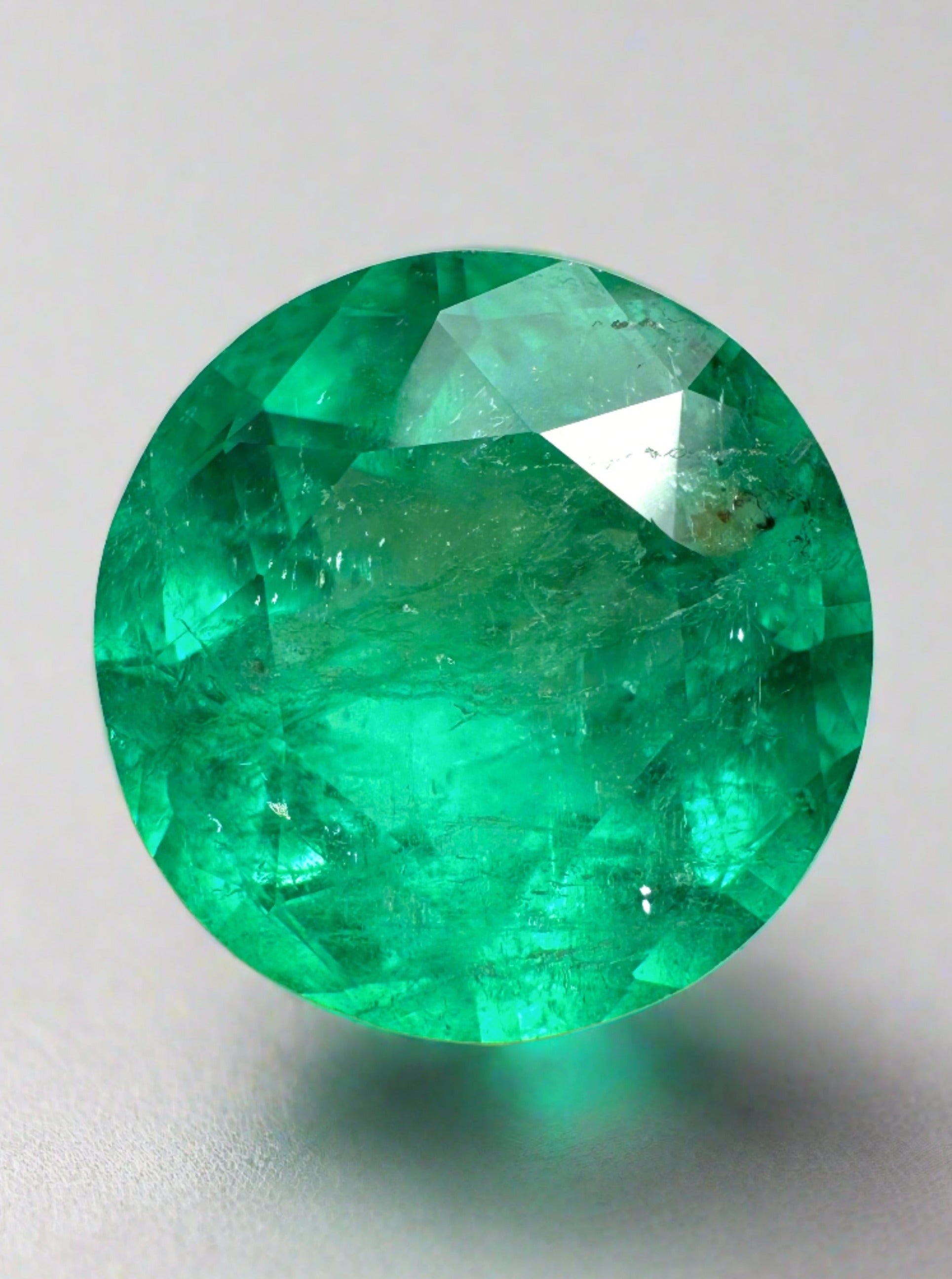 Natural round Colombian emerald, 4.50 carats, 11x11 mm, bluish green, loose gemstone from JR Colombian Emeralds