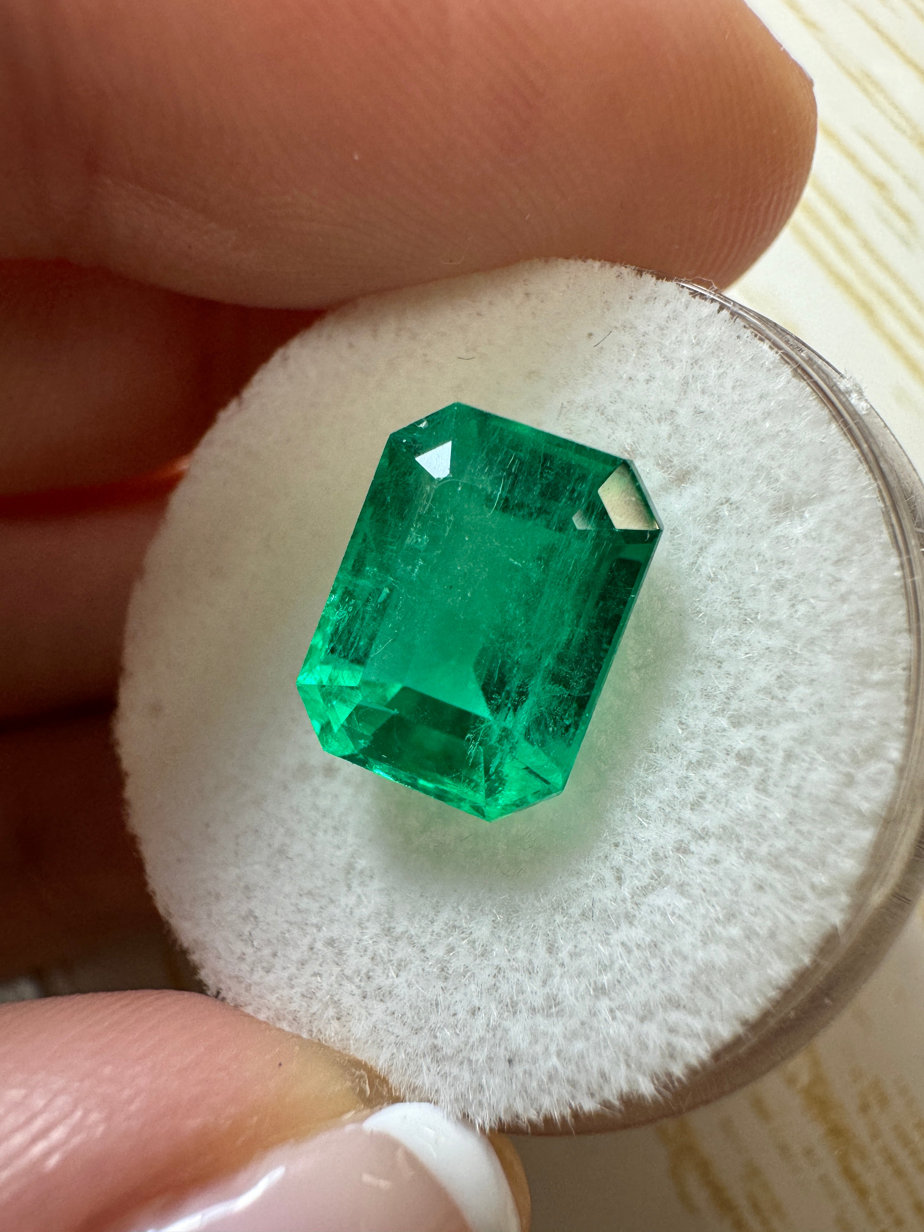 Vivid 4.53 Carat Muzo Green Colombian Emerald loose gemstone in an emerald cut, from JR Colombian Emeralds.
