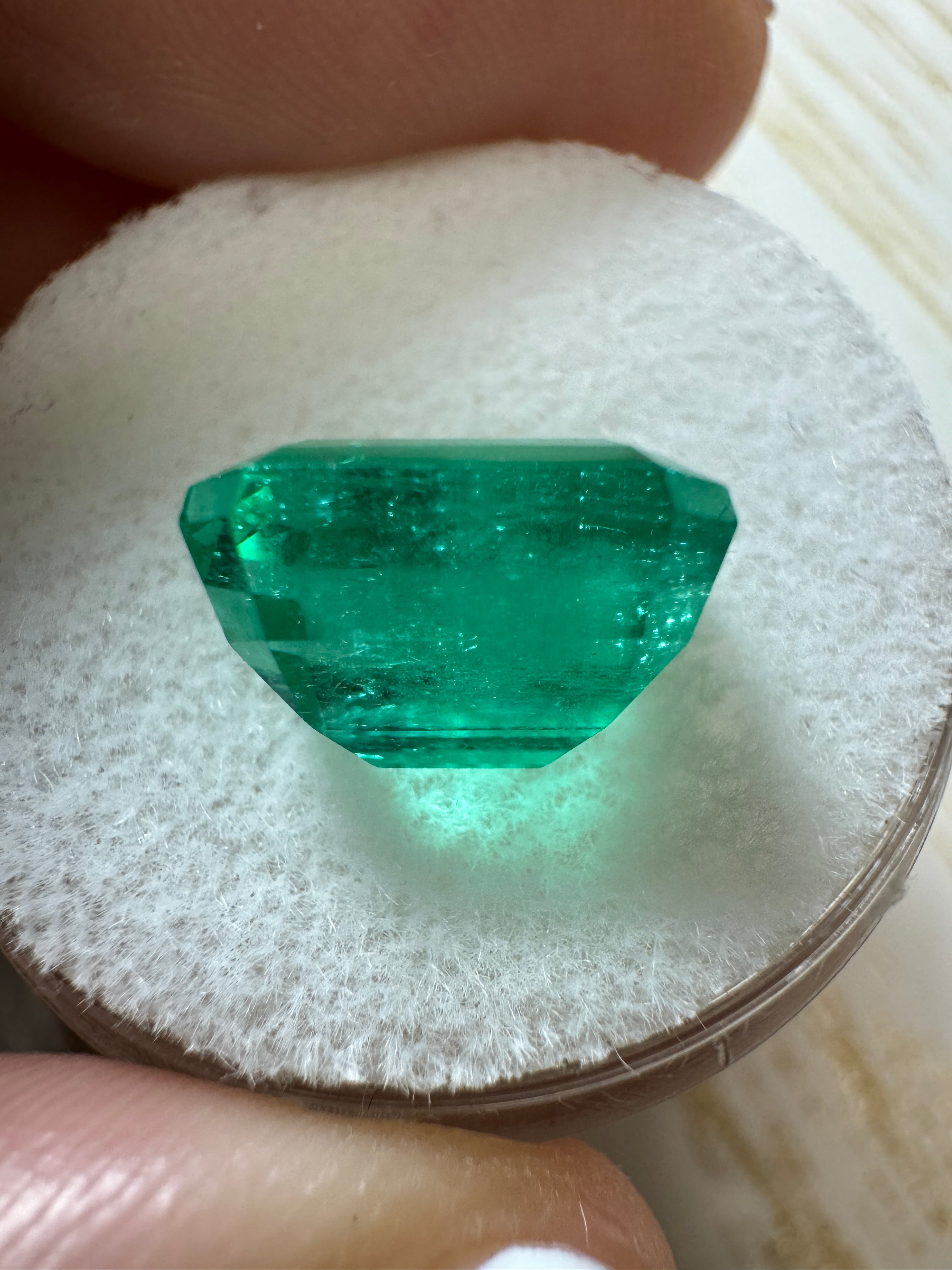 Vivid 4.53 Carat Muzo Green Colombian Emerald in emerald cut, natural loose gemstone from JR Colombian Emeralds.
